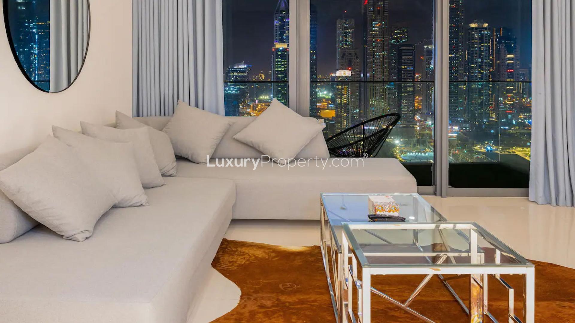"Stunning Dubai Harbour marina view from luxury 1-bedroom apartment at Emaar Beachfront.",Modern living room in 1-bedroom apartment with marina views, Dubai Harbour, Emaar Beachfront