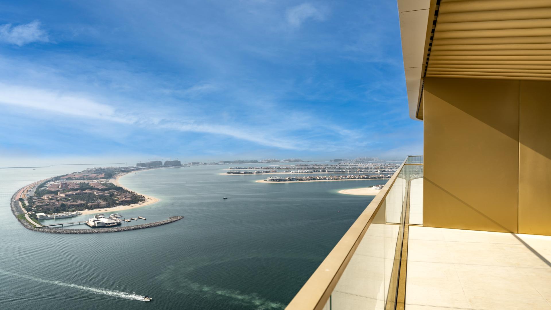 Modern beachfront apartment kitchen and living area with sea view in Dubai Harbour