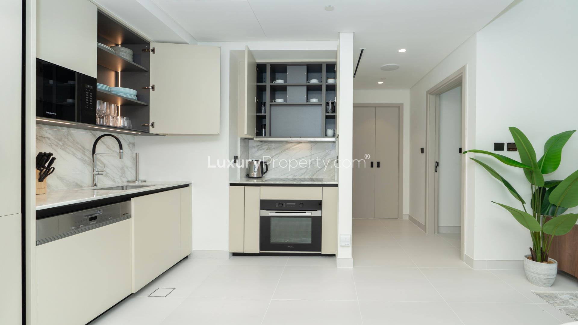 High-floor apartment balcony with stunning Burj Al Arab and marina views at Emaar Beachfront