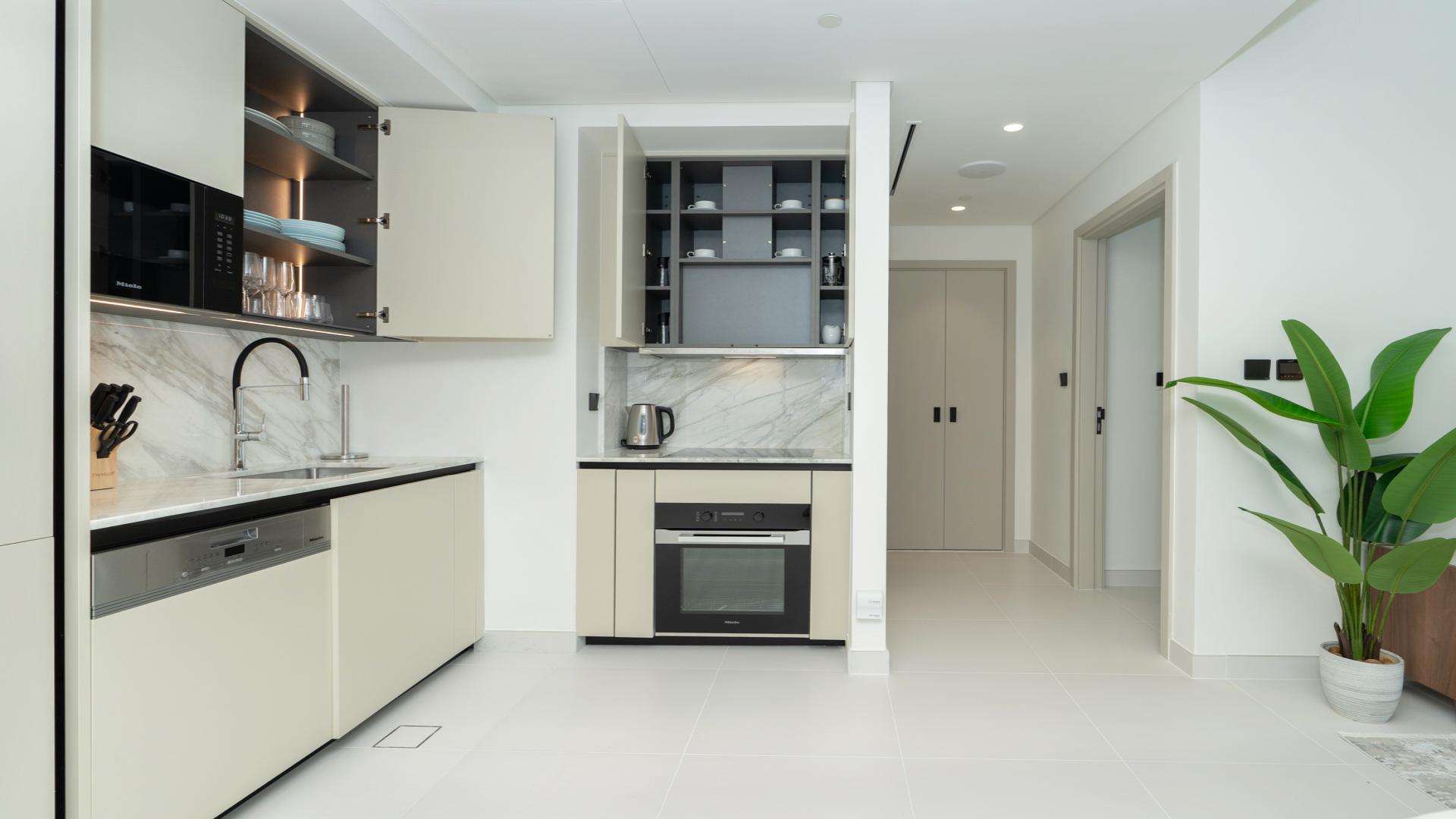 High-floor apartment balcony with stunning Burj Al Arab and marina views at Emaar Beachfront