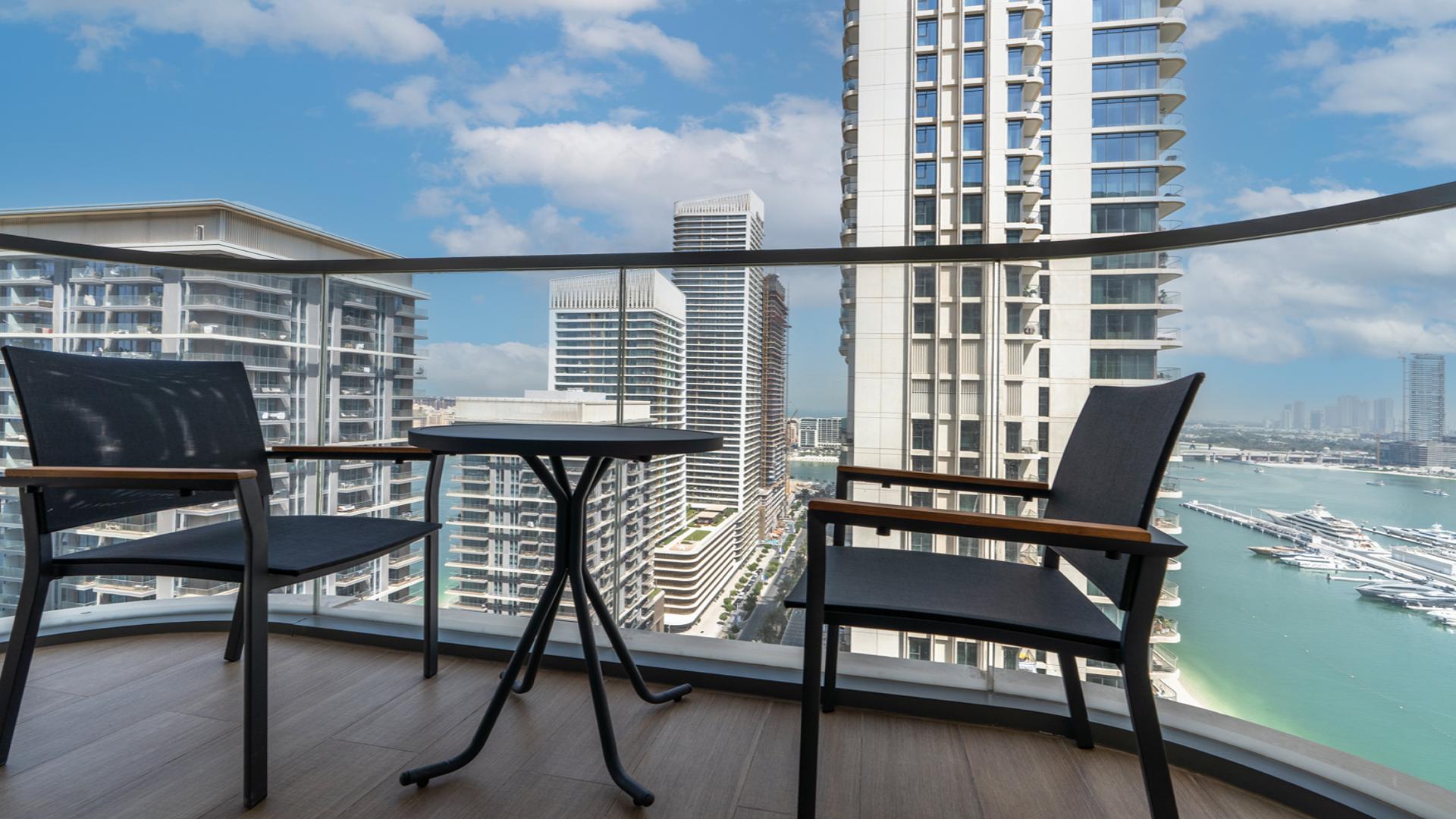 Modern living room in Emaar Beachfront apartment, Dubai Harbour, with sea view and stylish decor