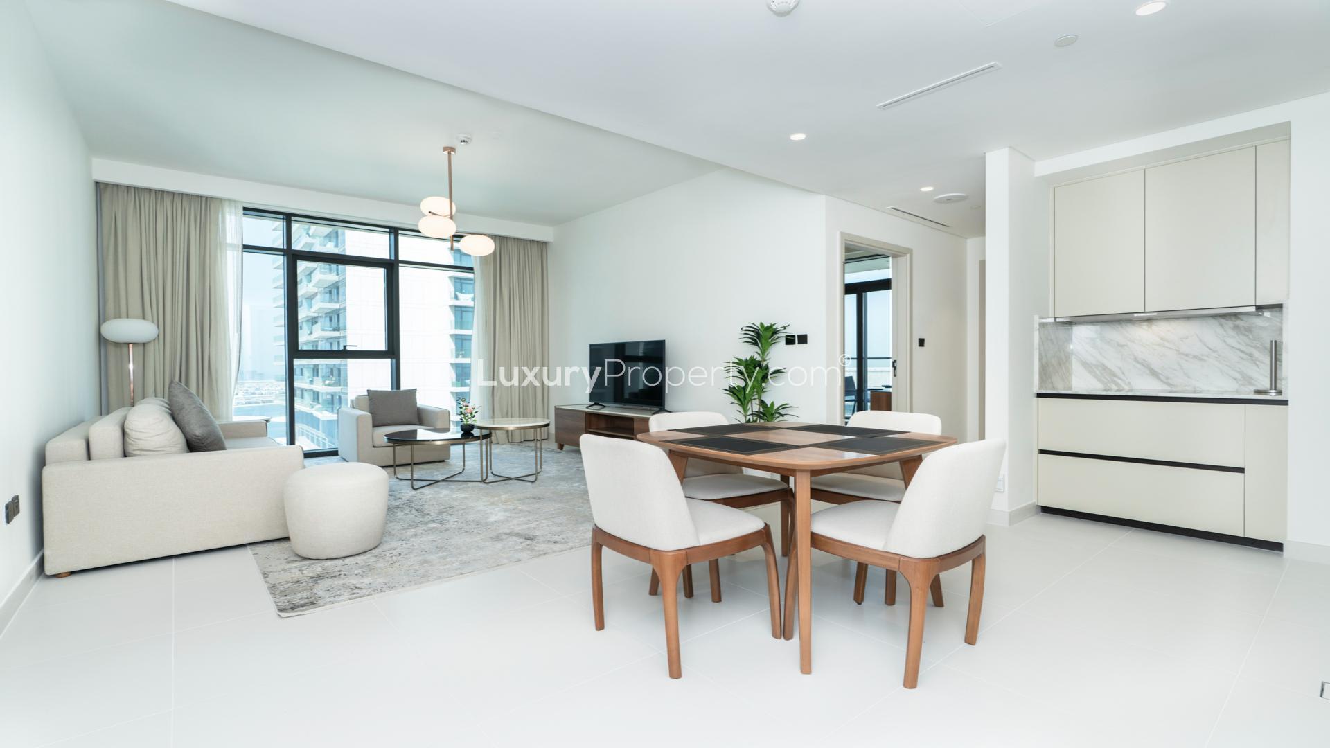 Balcony view of Dubai Harbour from Emaar Beachfront apartment, showcasing marina and skyscrapers