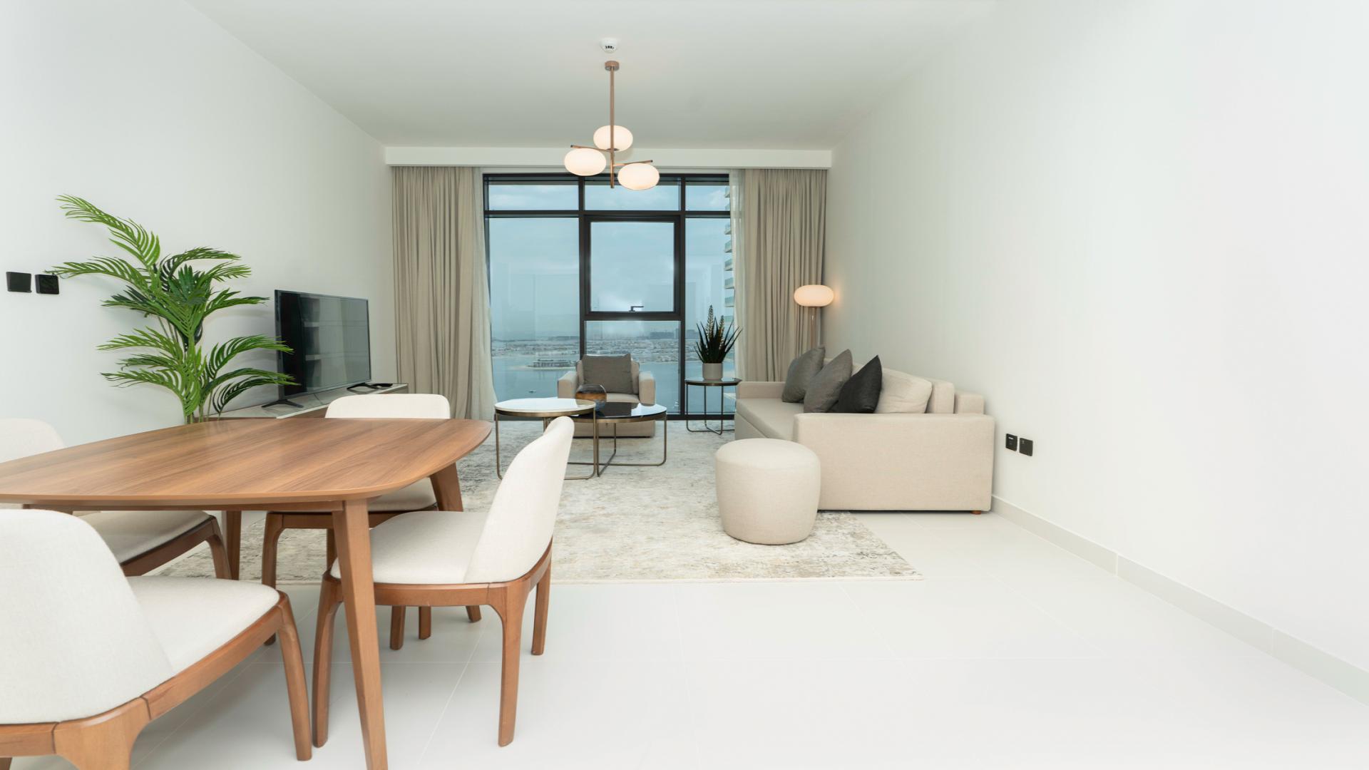 Modern 1-bedroom apartment interior in Emaar Beachfront, Dubai Harbour, featuring open living space