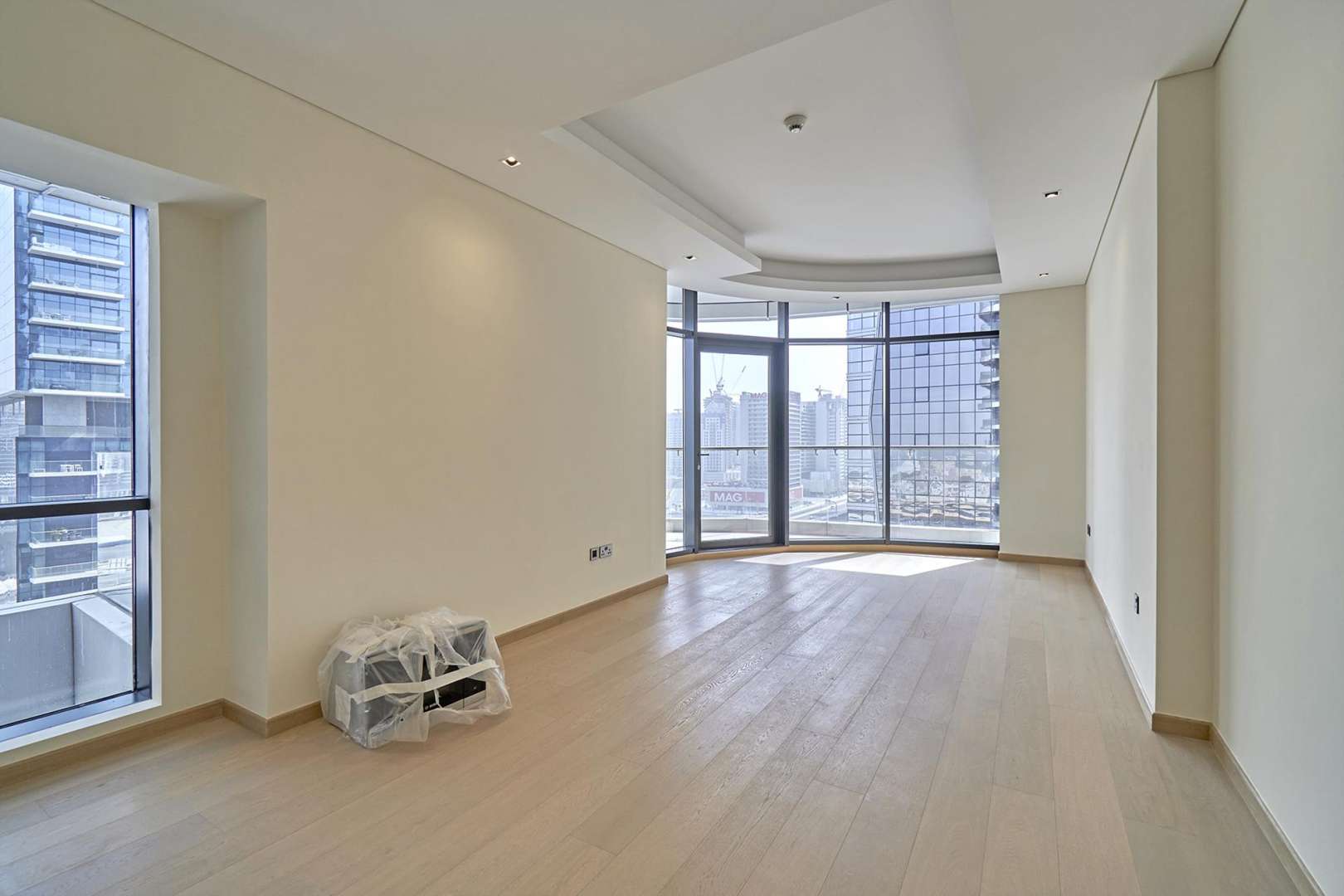 Luxurious empty apartment interior with large windows in RP Heights, Downtown Dubai