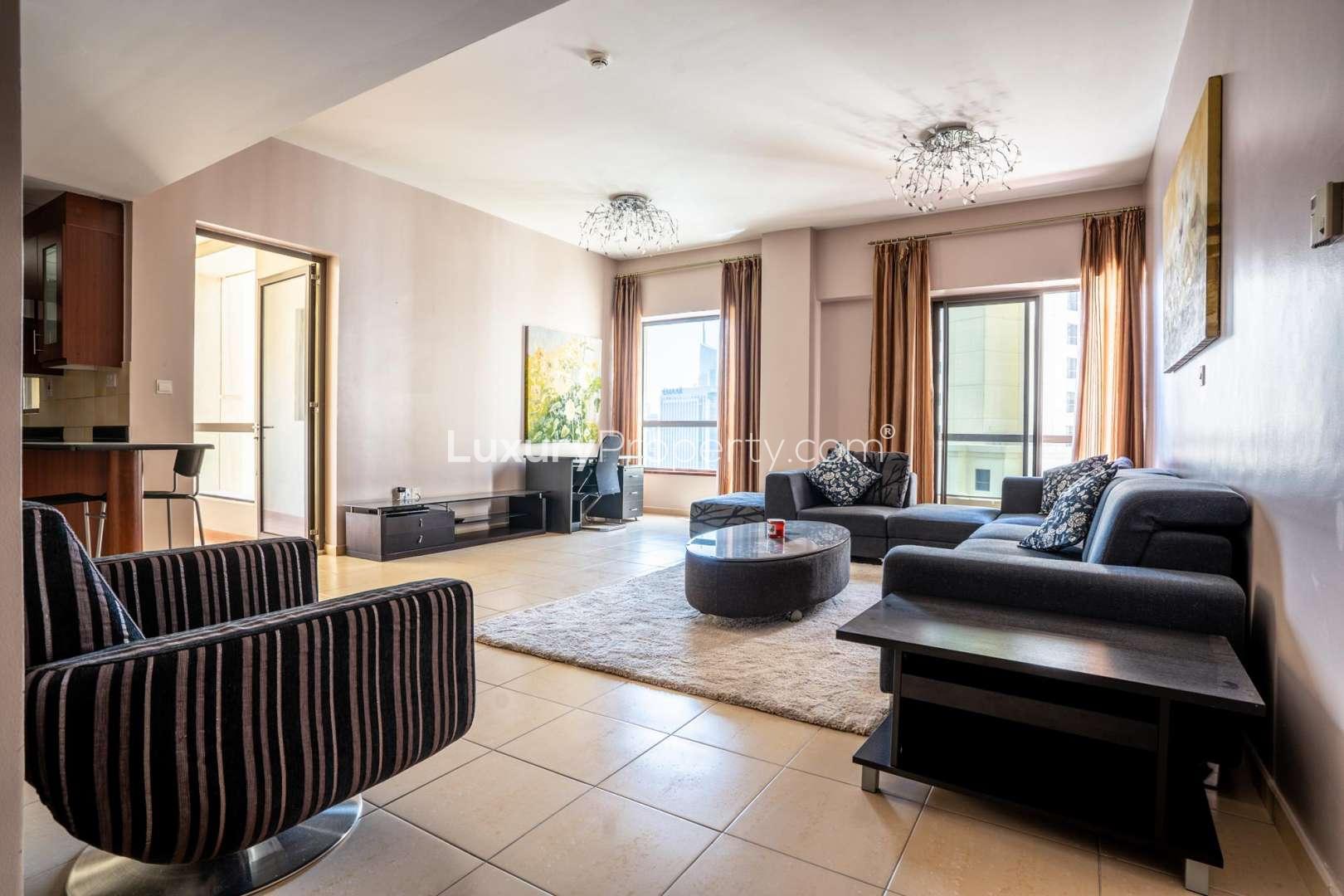 One-bedroom apartment interior with balcony view in Jumeirah Beach Residence, Sadaf community