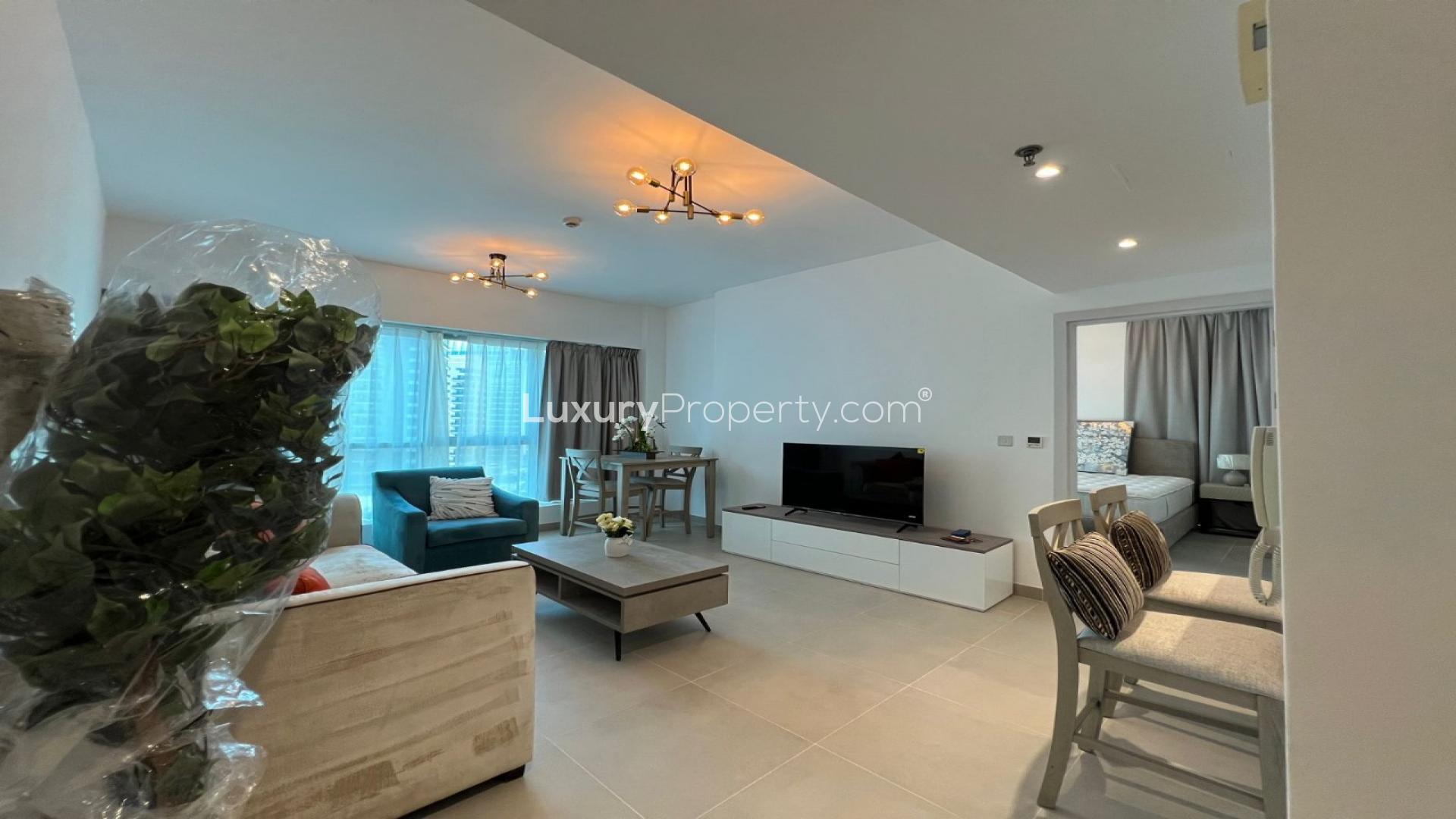 1-bedroom apartment interior with bed and window view in The Point, Dubai Marina