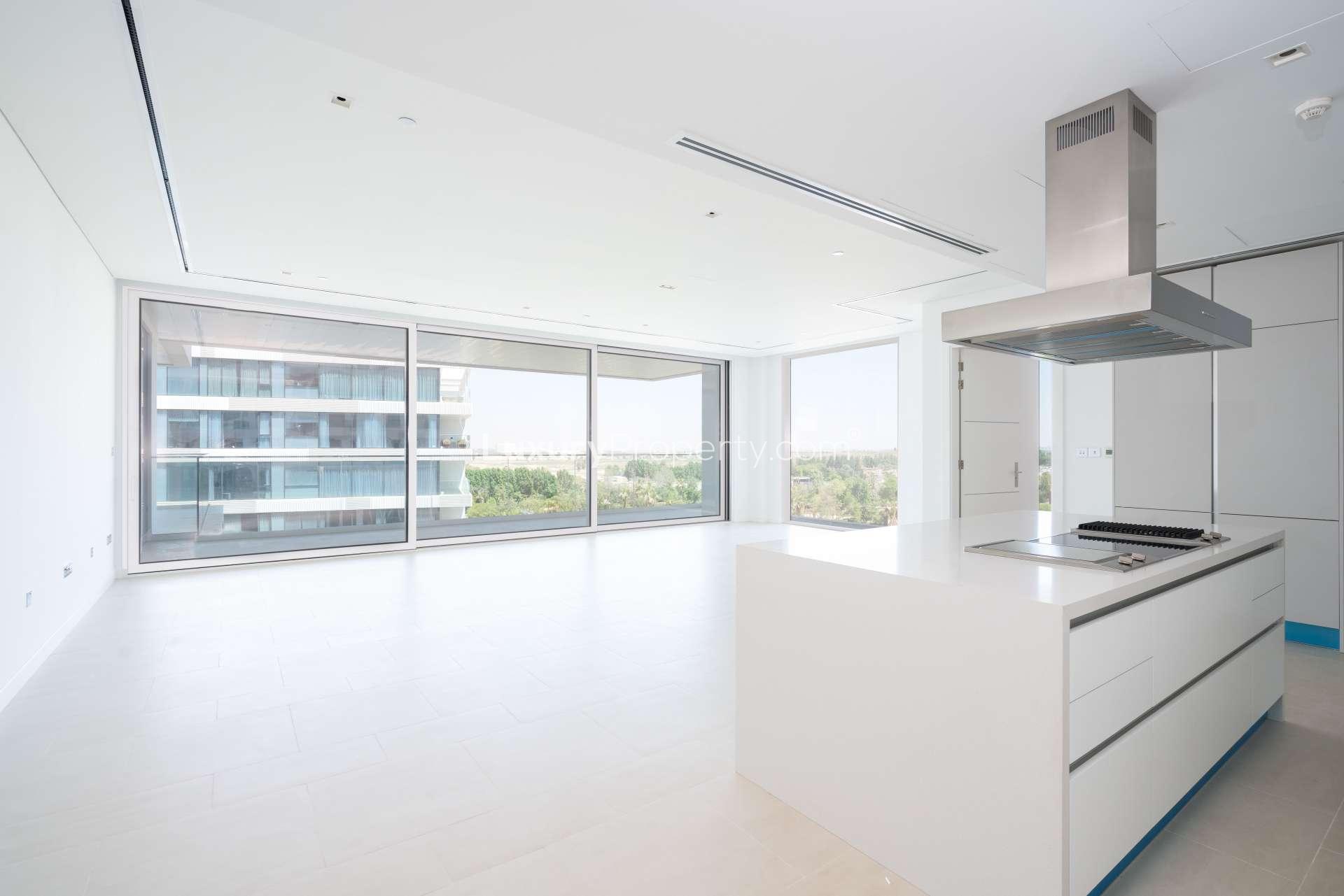 Modern 1-bedroom apartment exterior in Seventh Heaven, Al Barari, with glass balconies