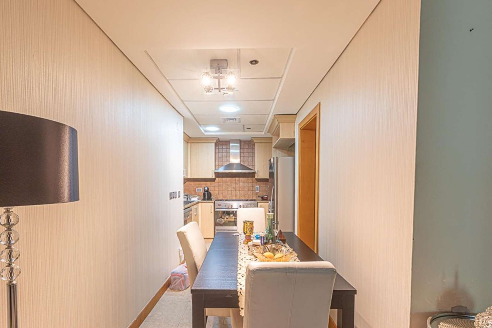 Furnished living room in Shoreline Apartments, Palm Jumeirah, featuring modern decor and large TV