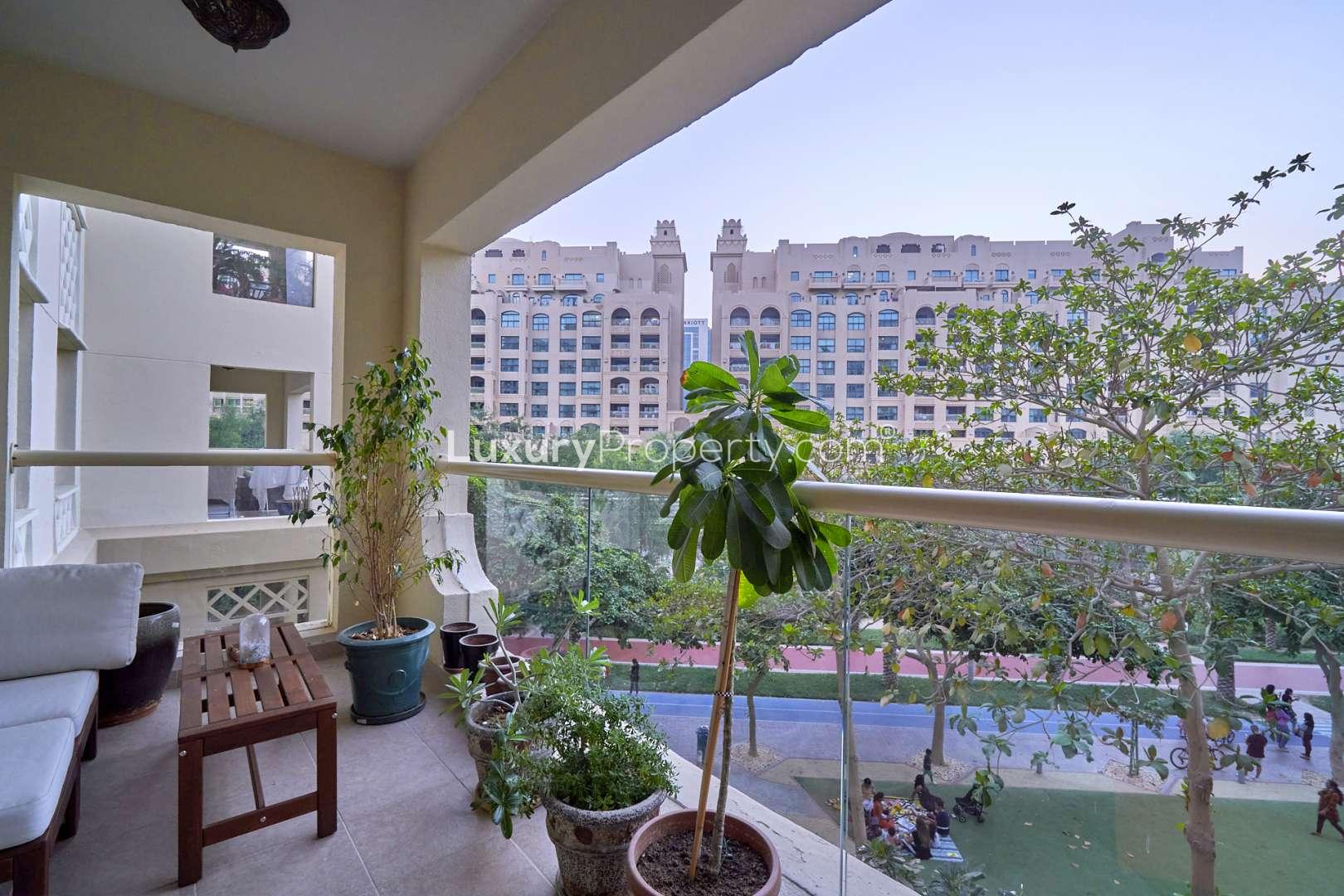Green park view from Shoreline Residences apartment, Palm Jumeirah, with trees and walkways