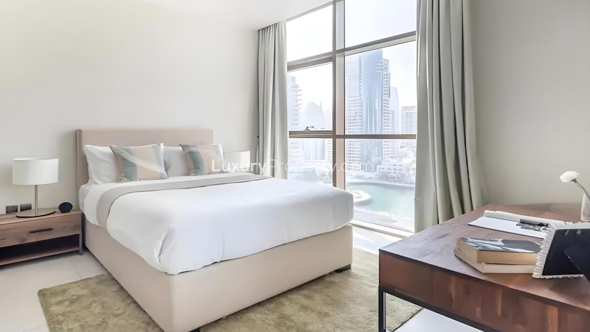 Modern living room in Dubai Marina apartment, featuring balcony and stylish furnishings