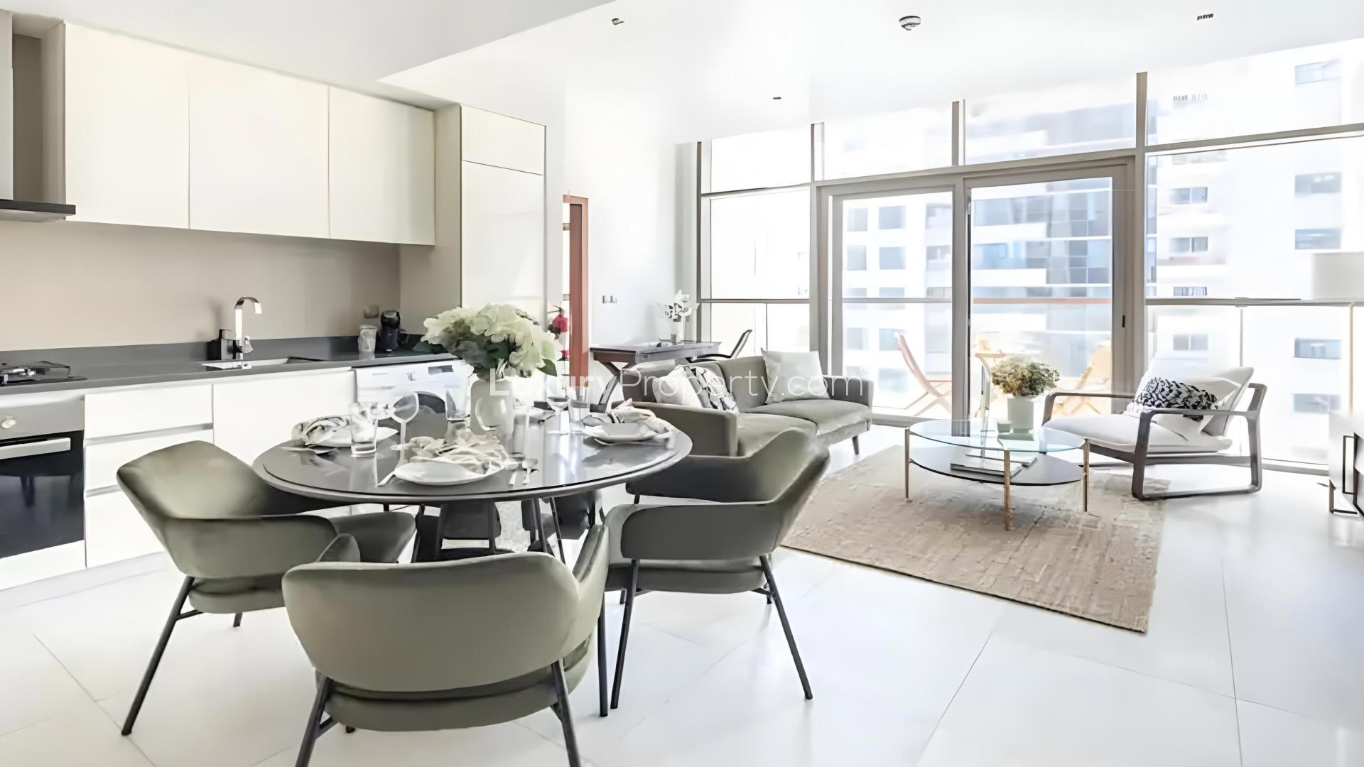 Modern living room in Dubai Marina apartment, featuring balcony and stylish furnishings