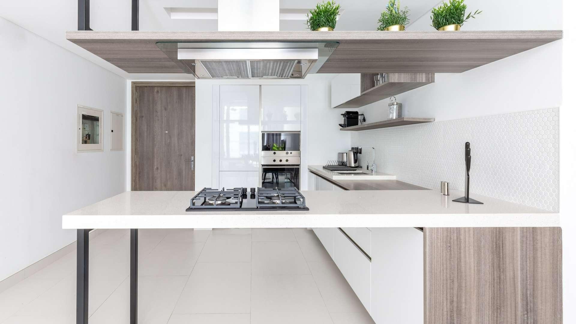 Boutique furnished apartment living room in Soho Palm Jumeirah with modern decor and seating