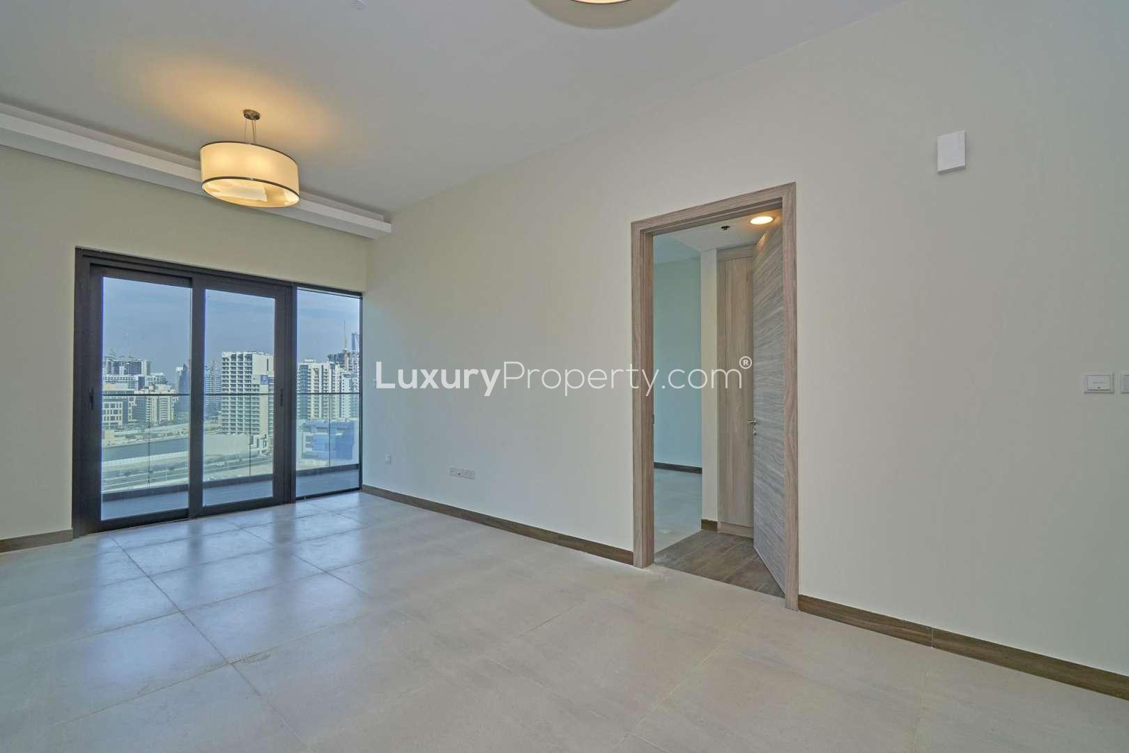 Elegant lobby of SOL Bay apartment building in Business Bay, featuring modern decor and seating