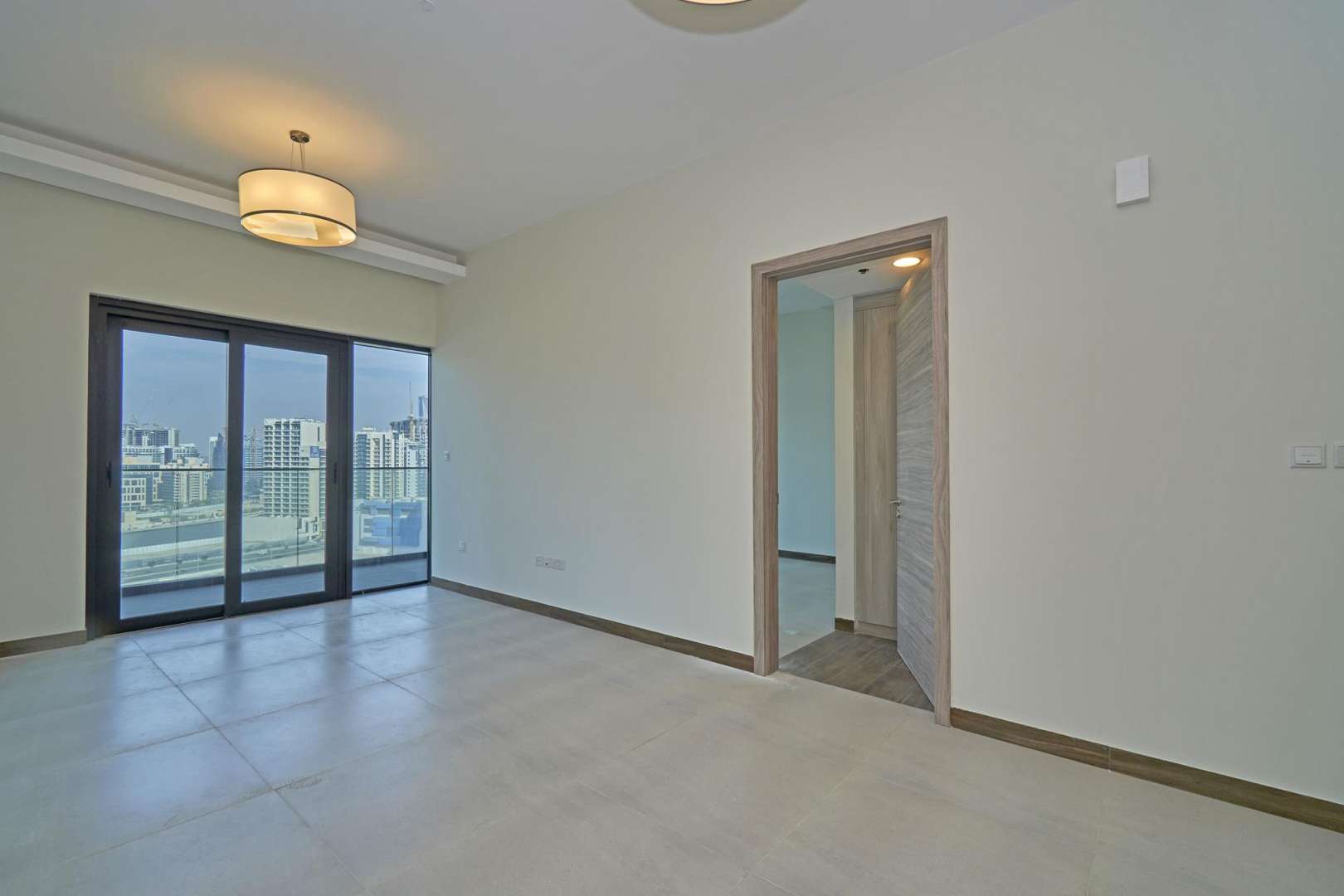 Elegant lobby of SOL Bay apartment building in Business Bay, featuring modern decor and seating