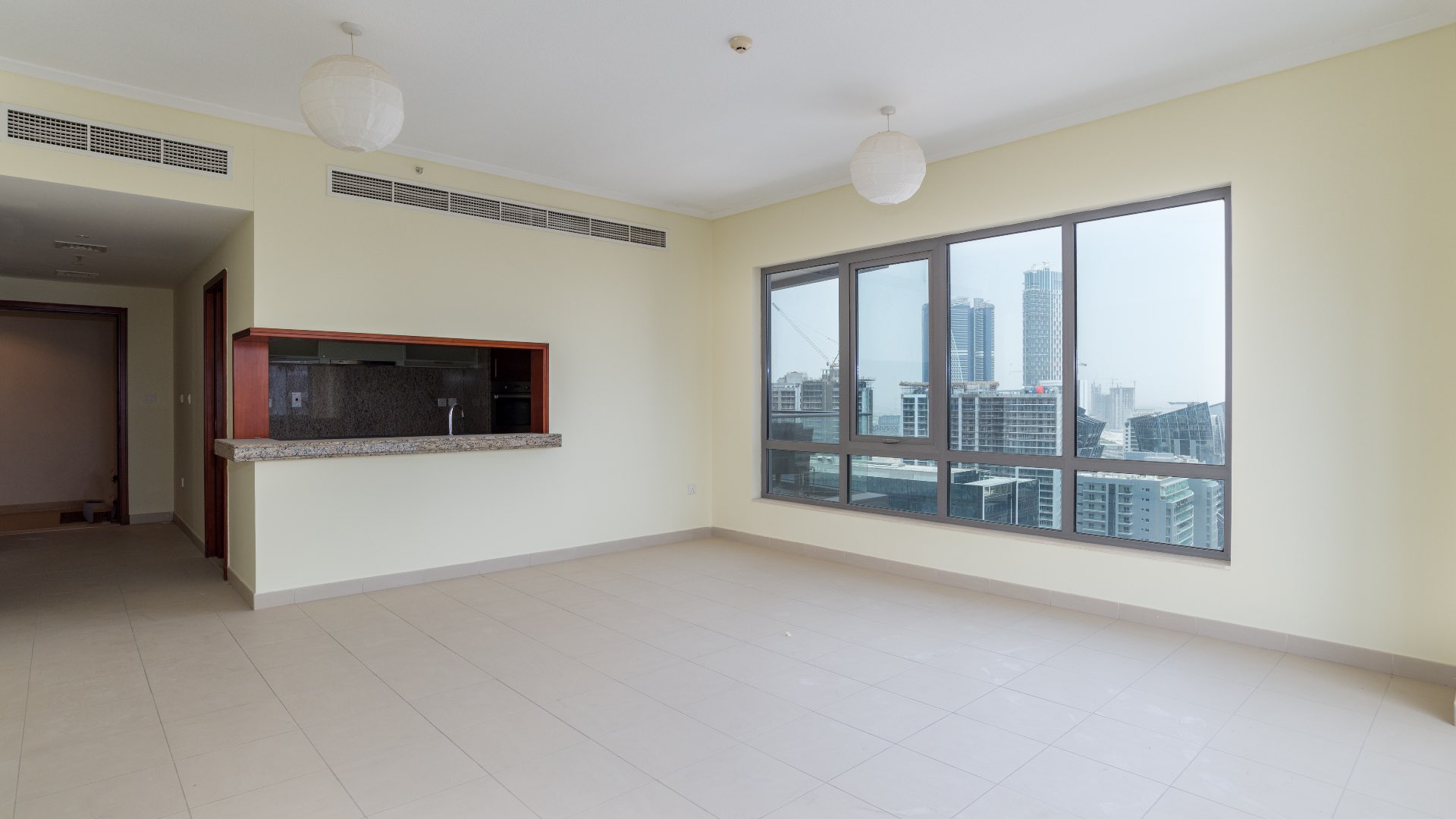 Bright living room with large windows in South Ridge apartment, Downtown Dubai