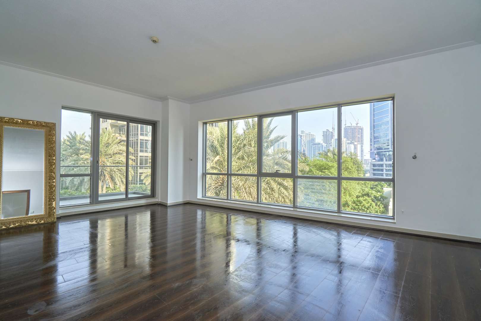 Empty living room in South Ridge Tower 1 apartment, Downtown Dubai, with tiled flooring