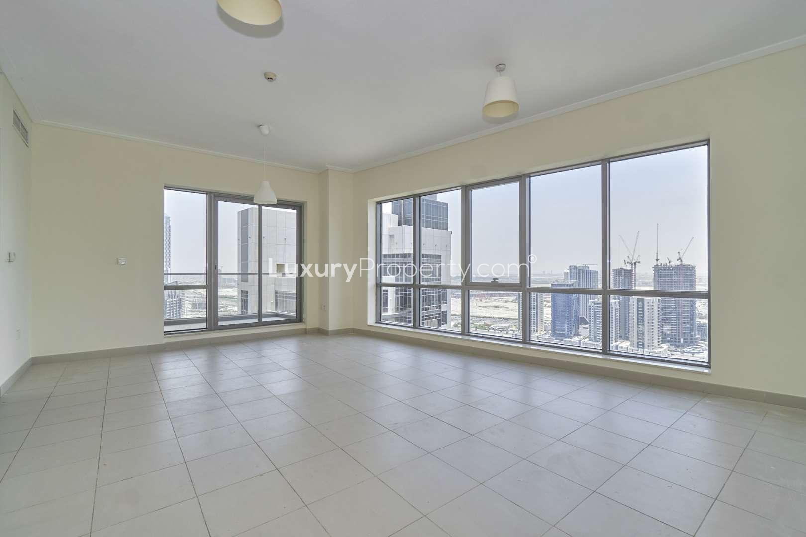 Empty living room with large windows and city view in South Ridge, Downtown Dubai apartment