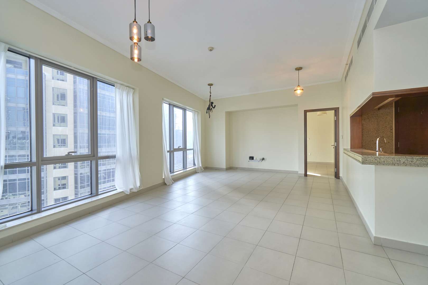 Spacious living room with large windows in South Ridge Tower 4, Downtown Dubai apartment