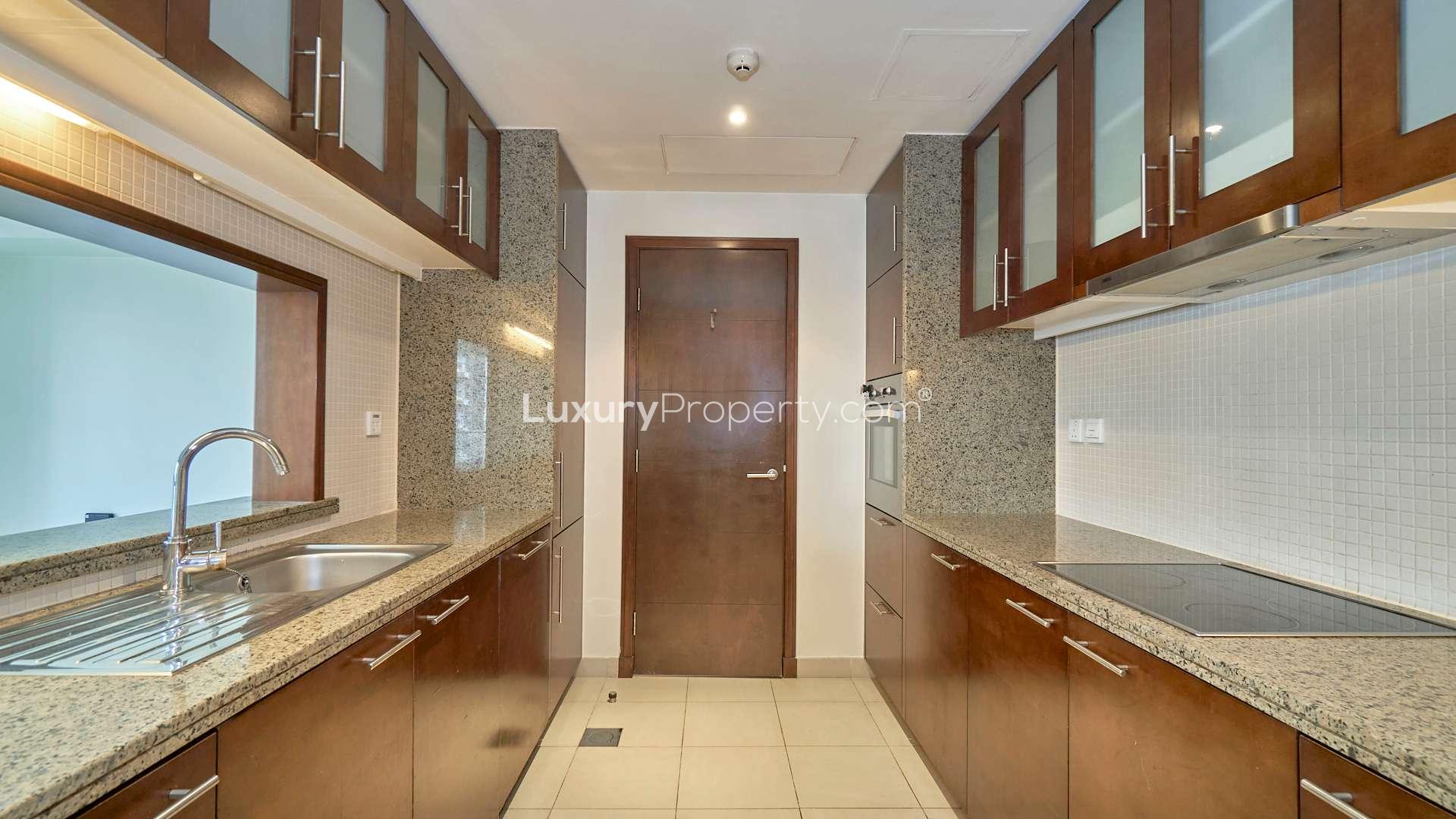 N/A,Modern kitchen in 1-bedroom apartment, South Ridge Tower 4, Downtown Dubai, granite countertops