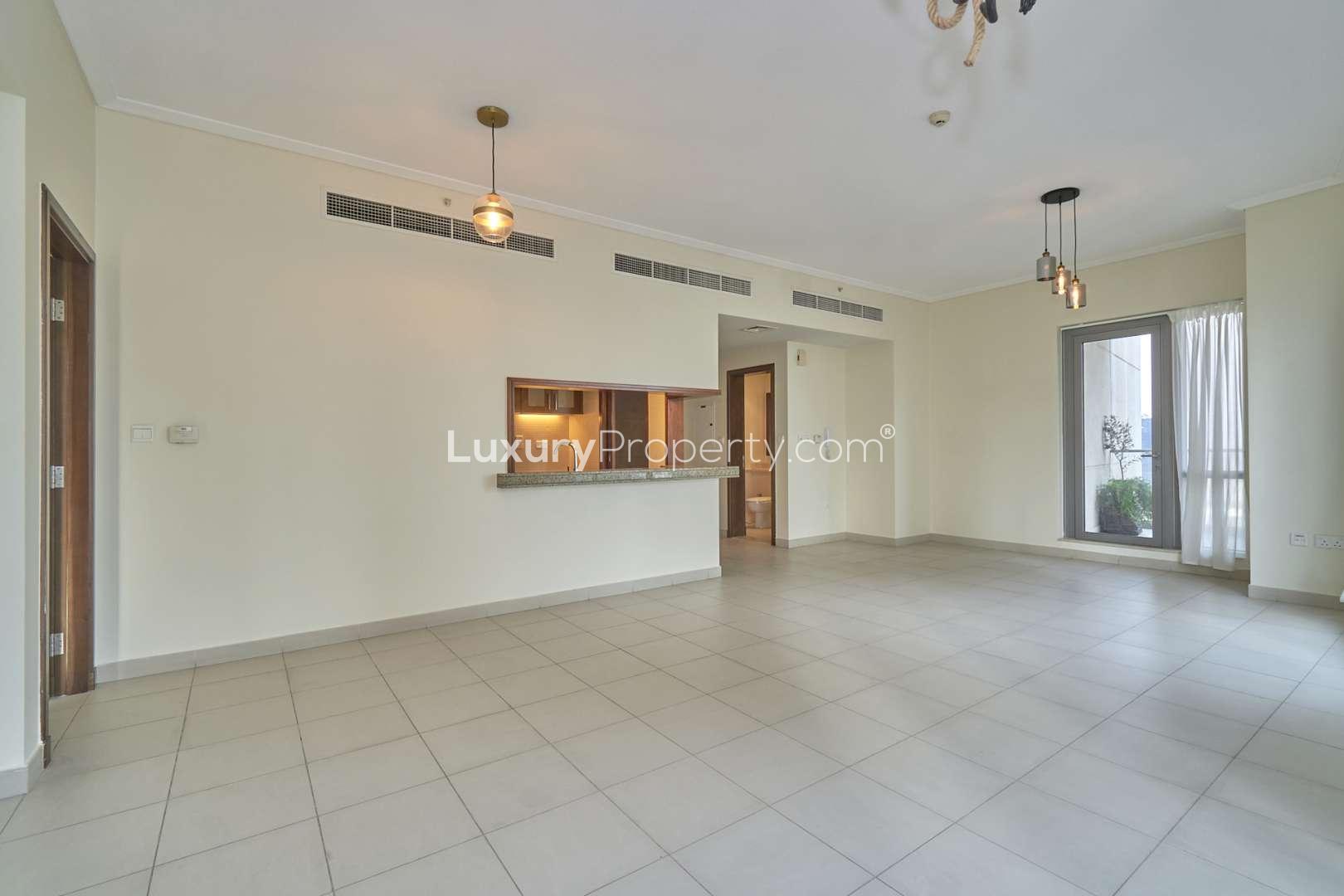 Bright living area with large windows offering canal views in South Ridge, Downtown Dubai