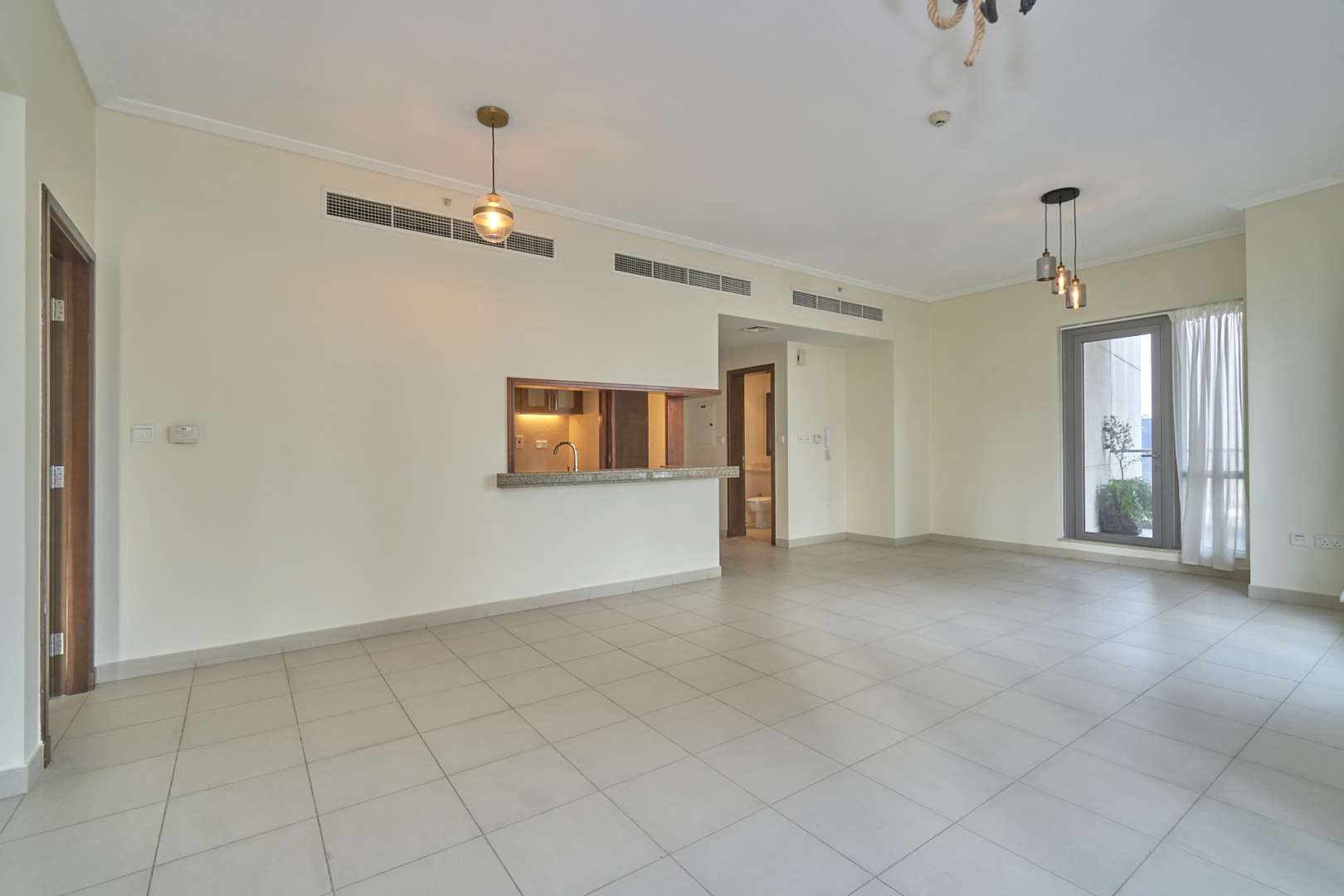 Bright living area with large windows offering canal views in South Ridge, Downtown Dubai