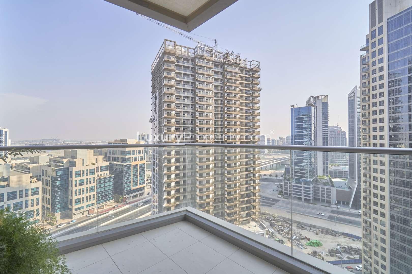 Cozy 1-bedroom apartment interior with large windows in South Ridge, Downtown Dubai