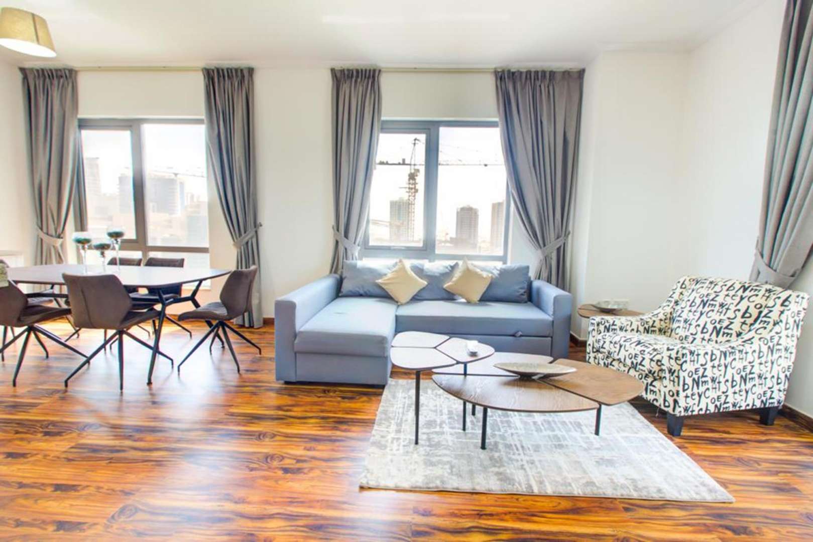 Modern living room in 1-bedroom apartment, South Ridge, Downtown Dubai, with stylish furniture