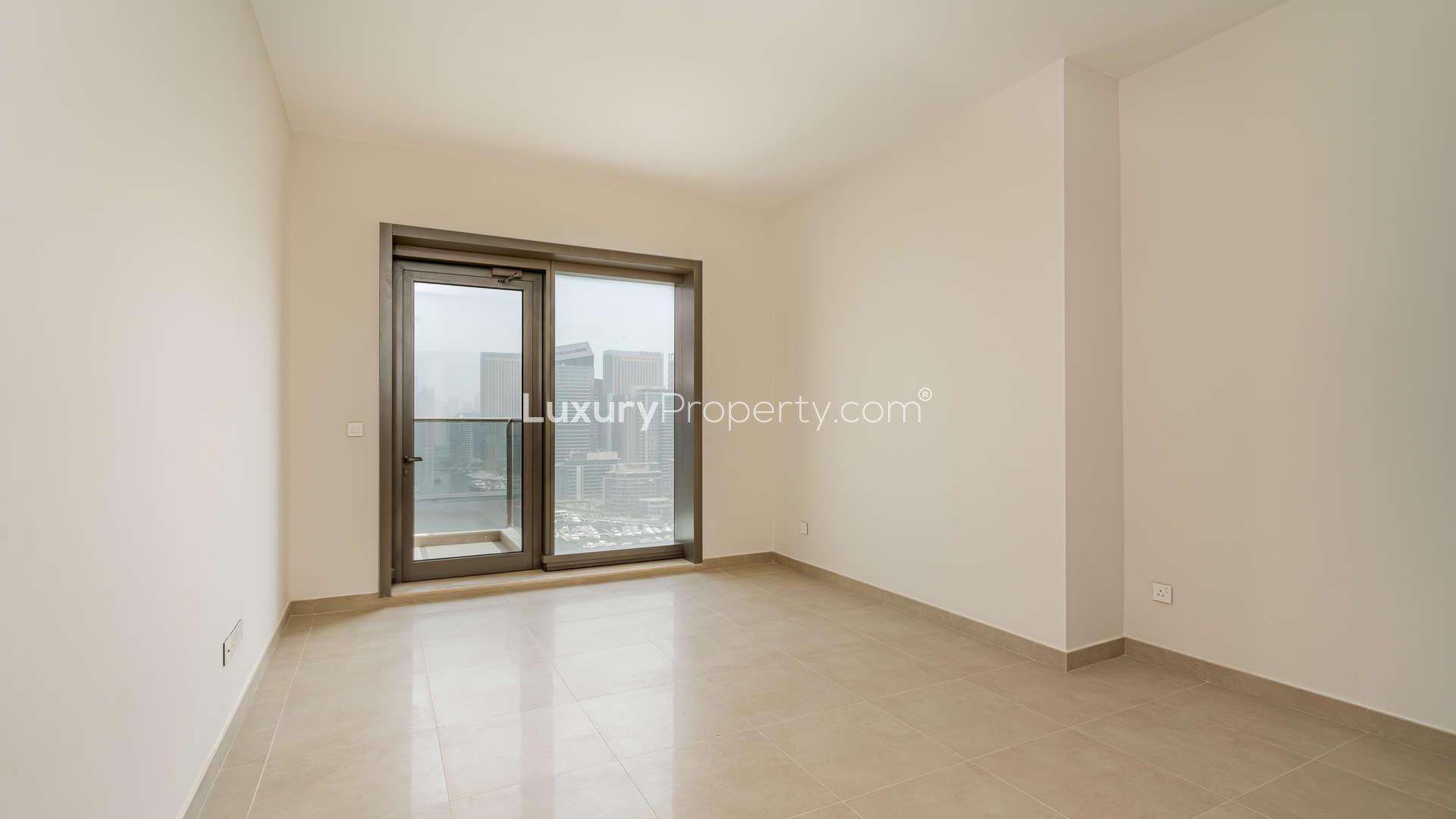 Empty room with large window, marina view in Sparkle Towers, Dubai Marina apartment for rent