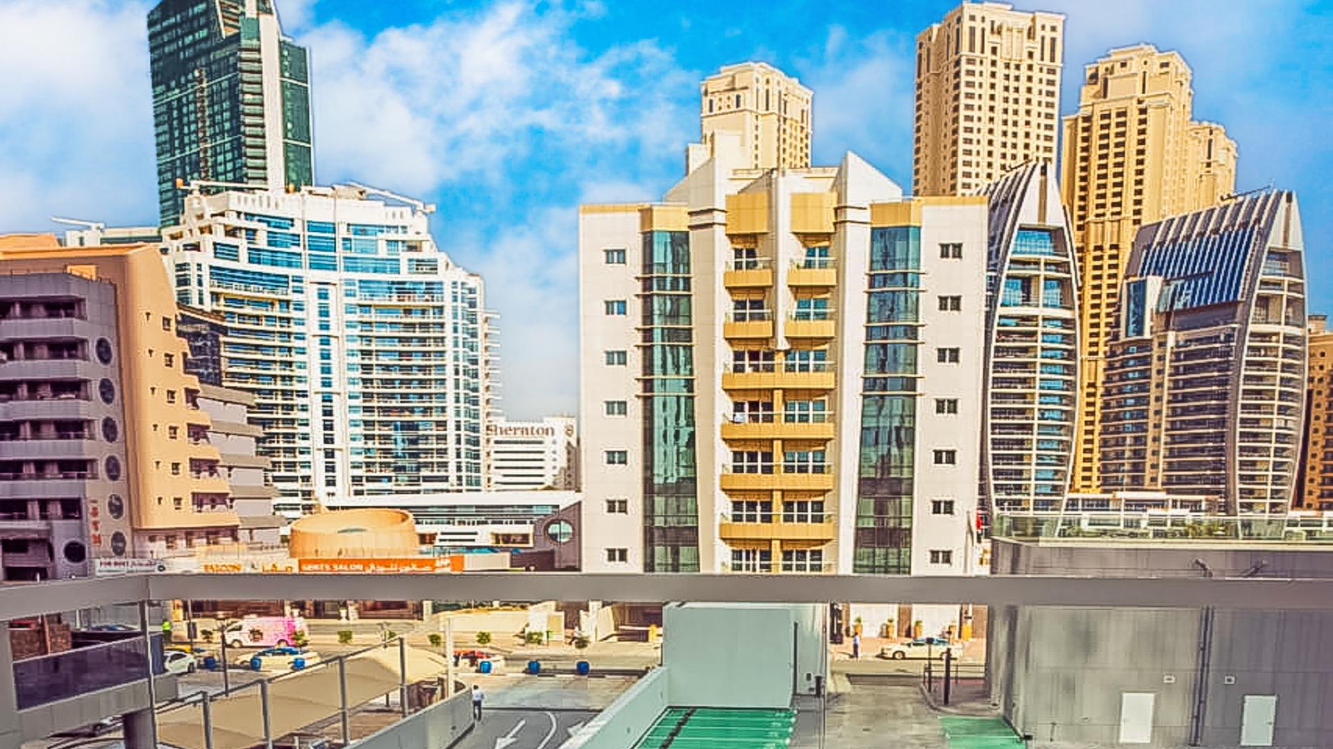Balcony view from Studio One apartment, Dubai Marina skyline in background