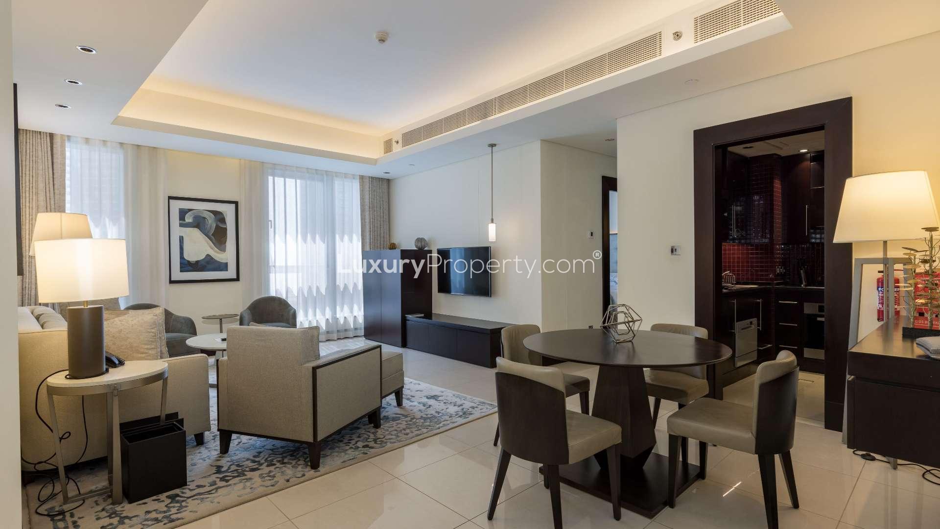 Furnished living room in Downtown Dubai apartment with modern decor and city views
