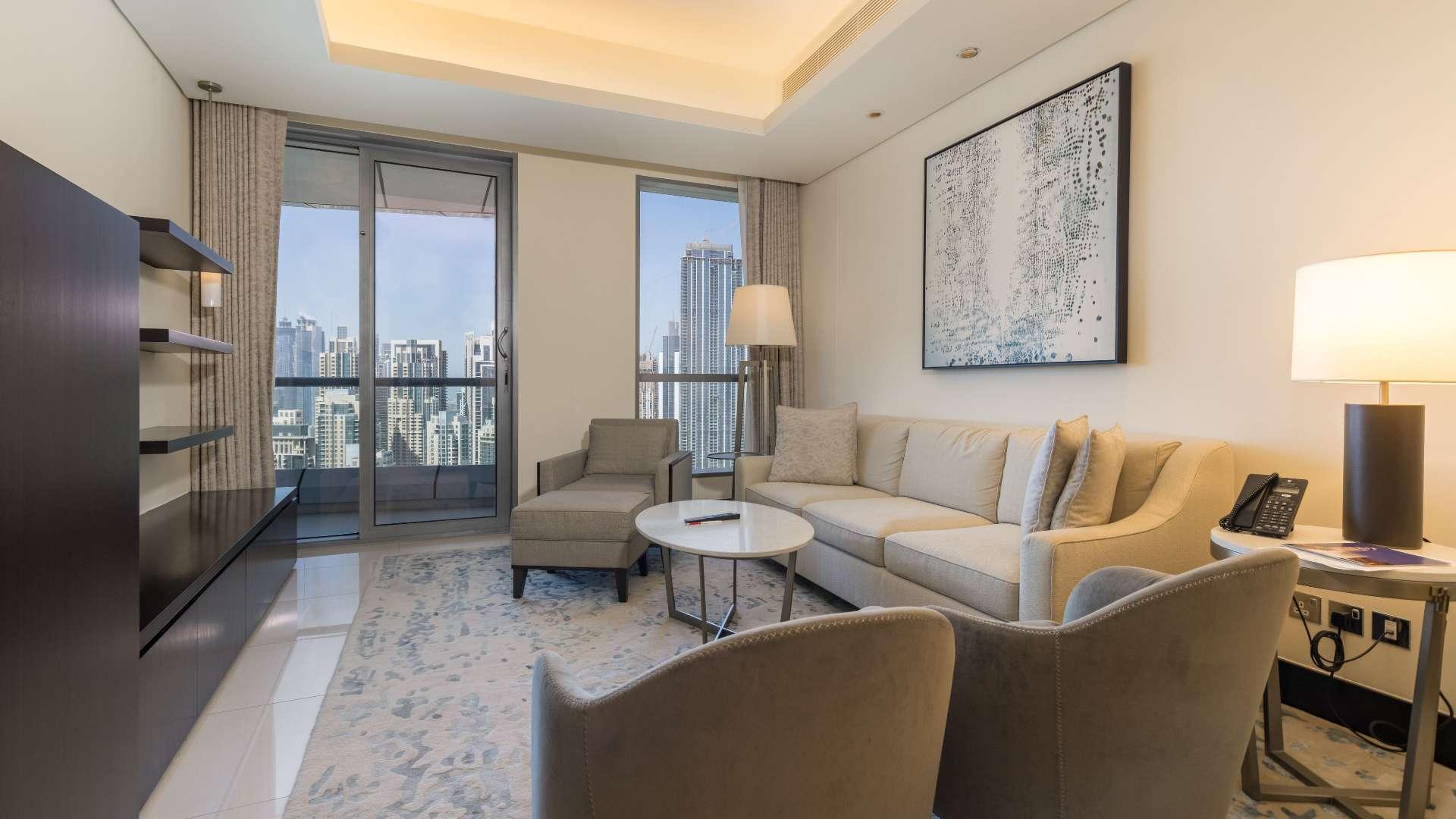 Balcony view from a furnished apartment in Downtown Dubai overlooking city skyline and Burj Khalifa