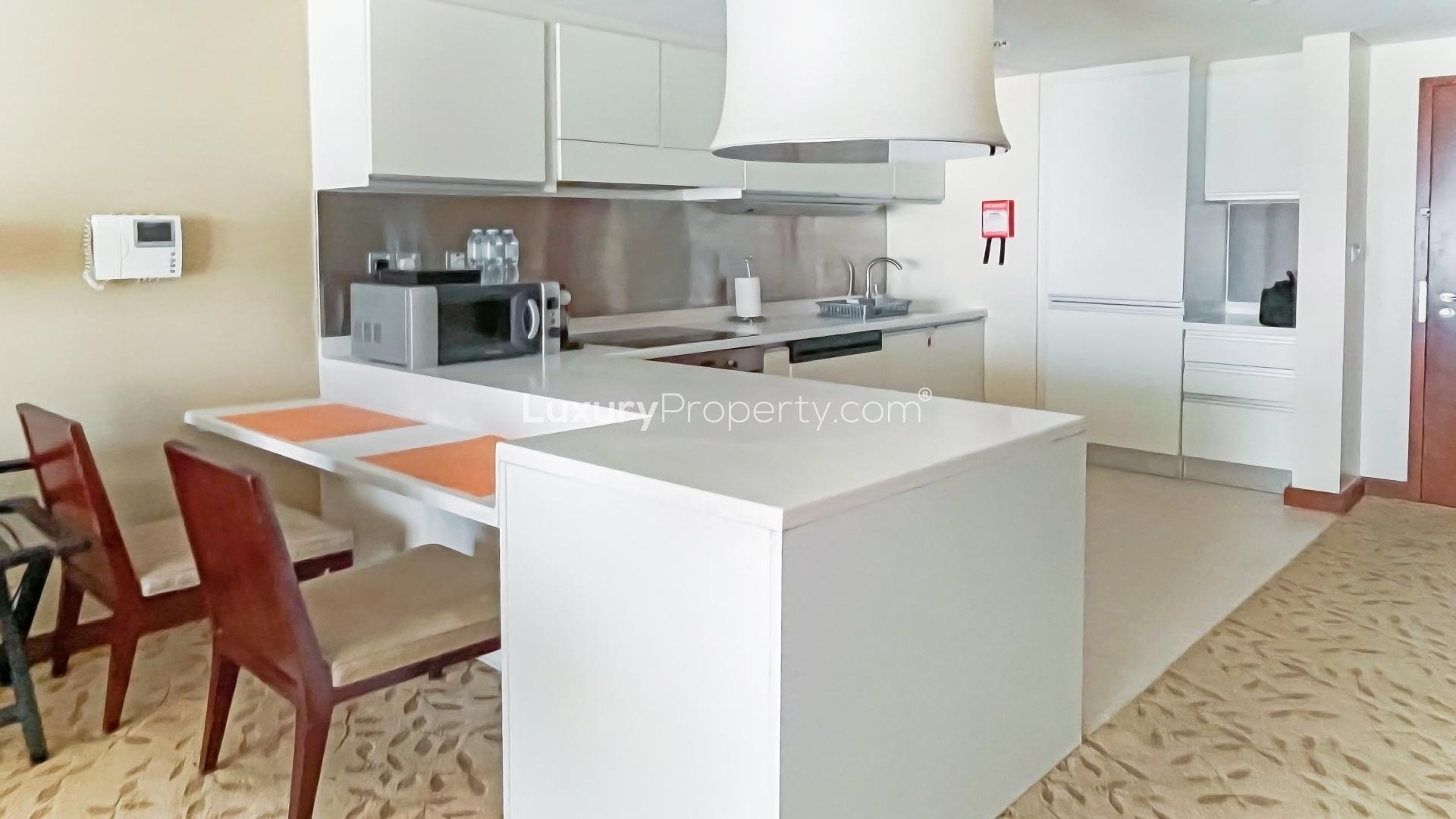 N/A,Furnished kitchen and dining area in Downtown Dubai apartment with Dubai Mall access