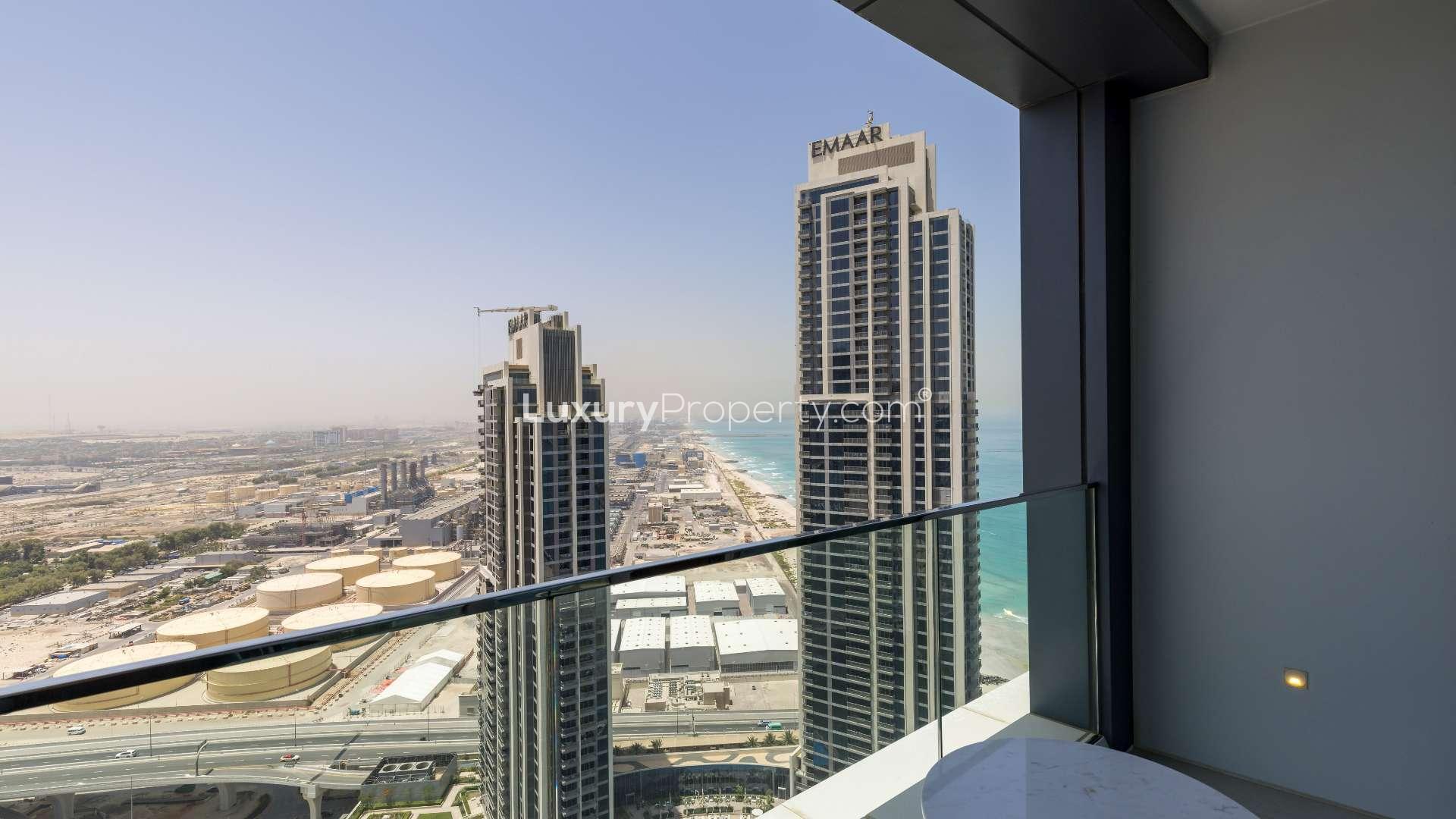 "Modern living room in serviced apartment, The Address JBR, Jumeirah Beach Residence, for rent.",Balcony view from serviced apartment at The Address JBR, overlooking cityscape and ocean