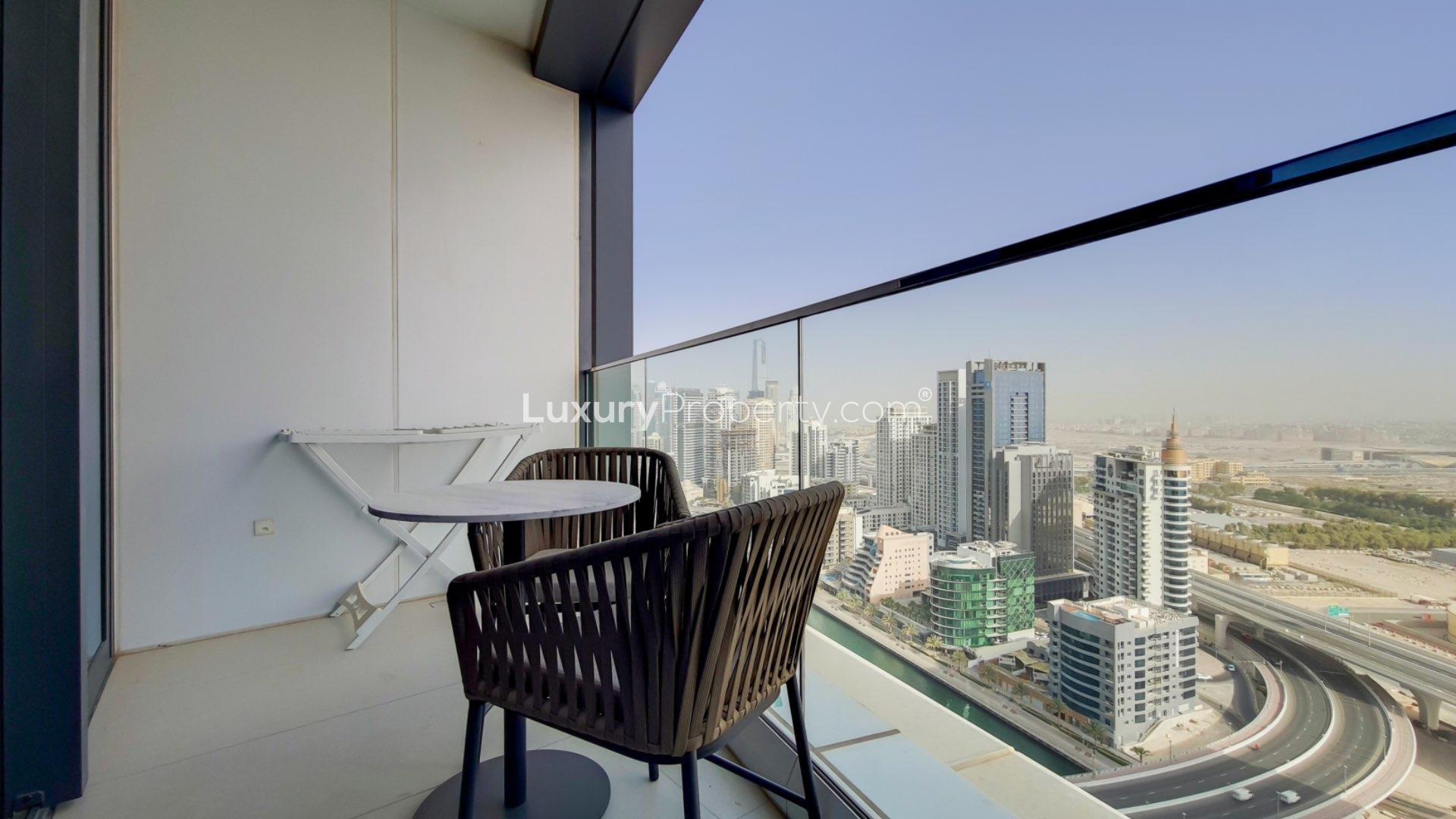 Modern living room in Jumeirah Beach Residence apartment, featuring balcony with city views