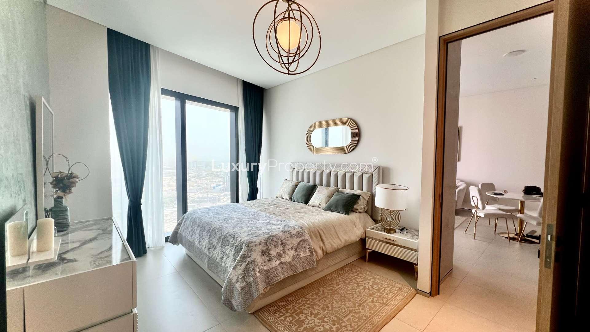 Luxury bedroom in Jumeirah Beach apartment with modern decor and large window view