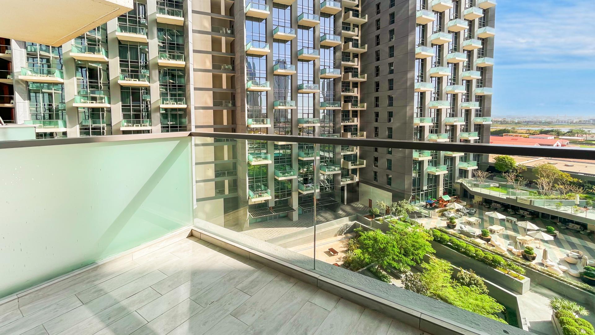 Unfurnished apartment with large windows and pool view in The Atria, Business Bay