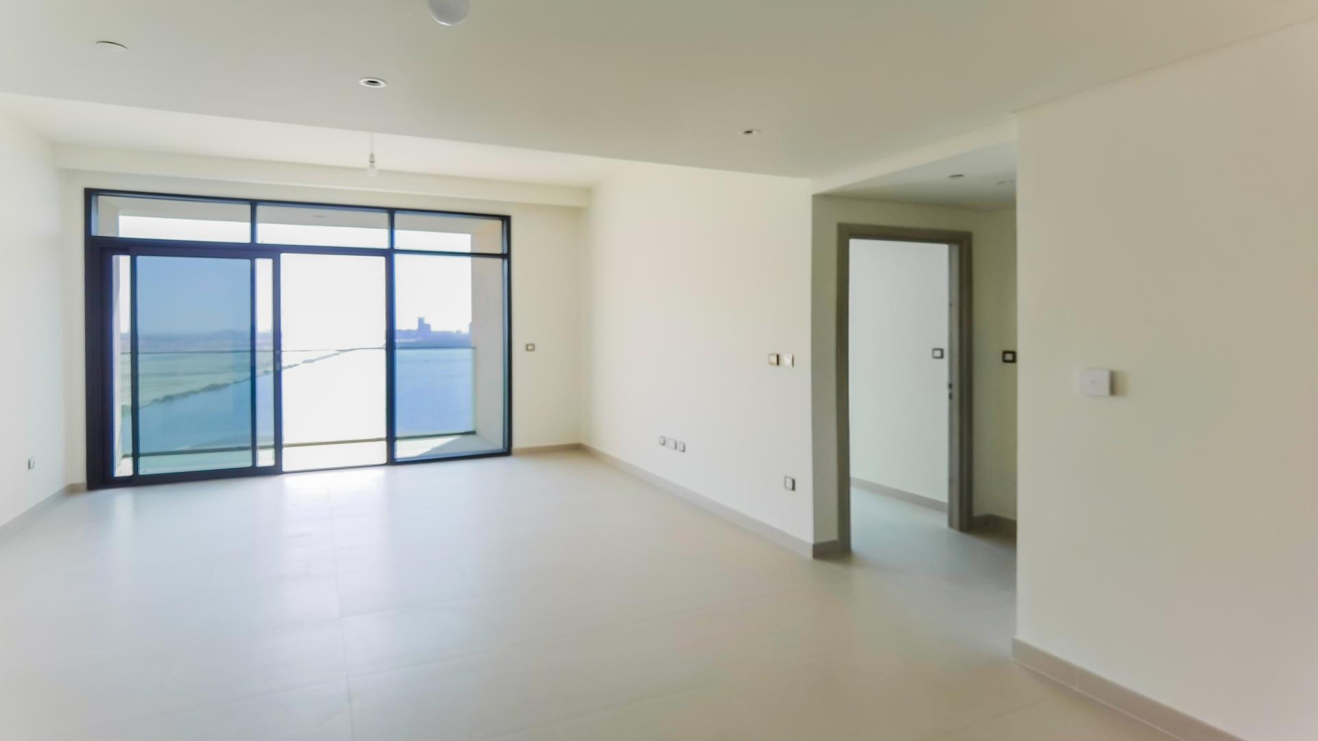 Modern apartment view overlooking Dubai Creek Harbour skyline and water, The Cove community