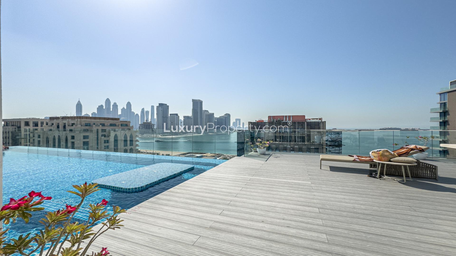 Modern kitchen and living area in fully furnished Soho Palm Jumeirah apartment