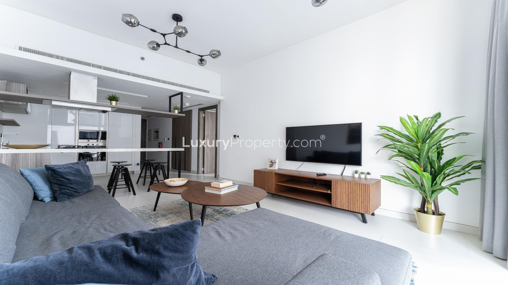 Rooftop infinity pool with city skyline view at Soho Palm Jumeirah apartment for rent