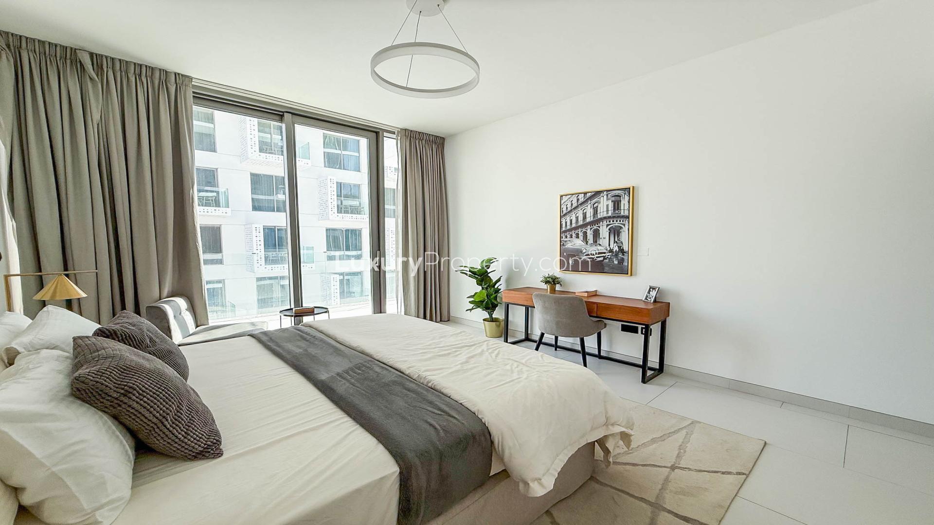 Modern bedroom in Soho Palm Jumeirah apartment for rent, featuring elegant decor and natural light