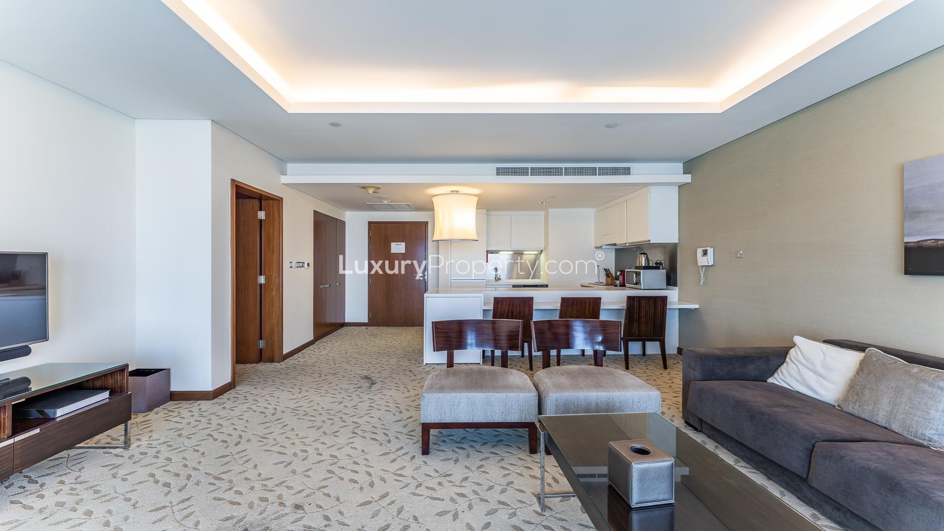 Modern living room and kitchen in Downtown Dubai 1-bedroom apartment for rent