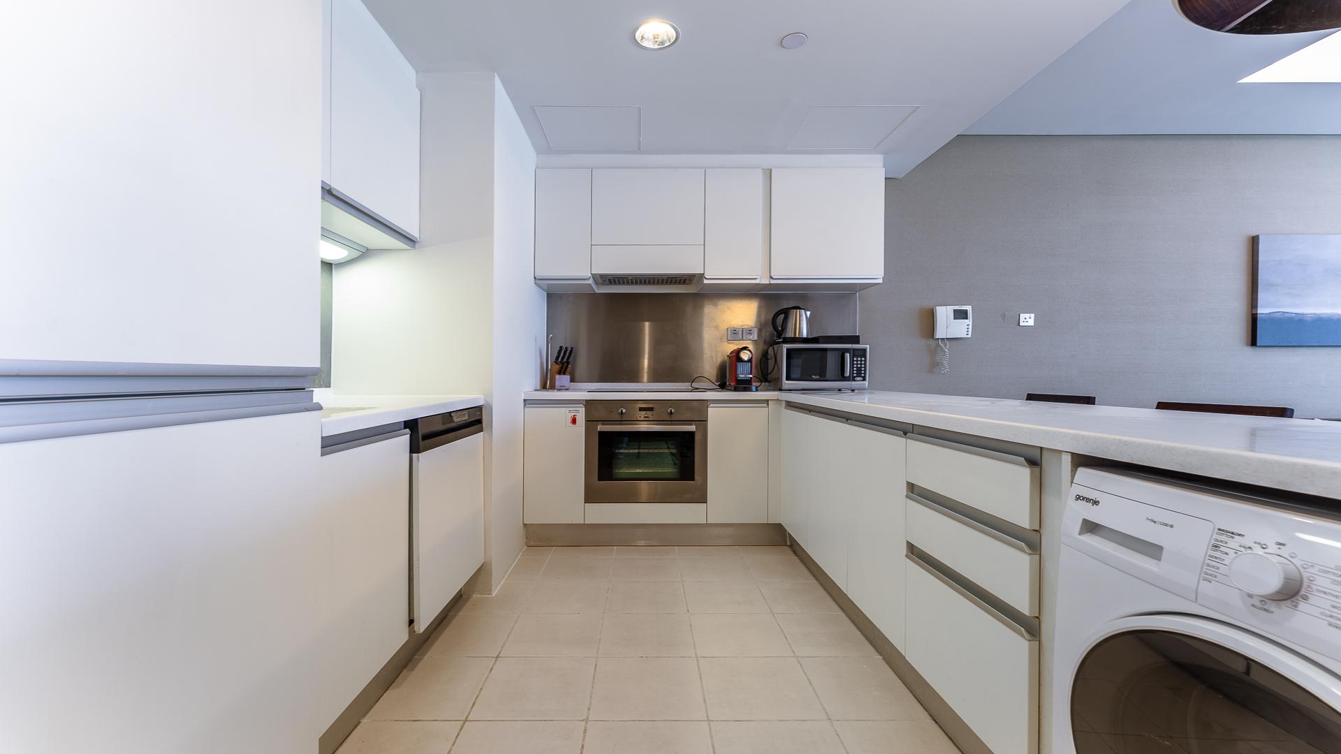 Modern living room in 1-bedroom apartment, Dubai Mall Residence, with stylish decor and amenities