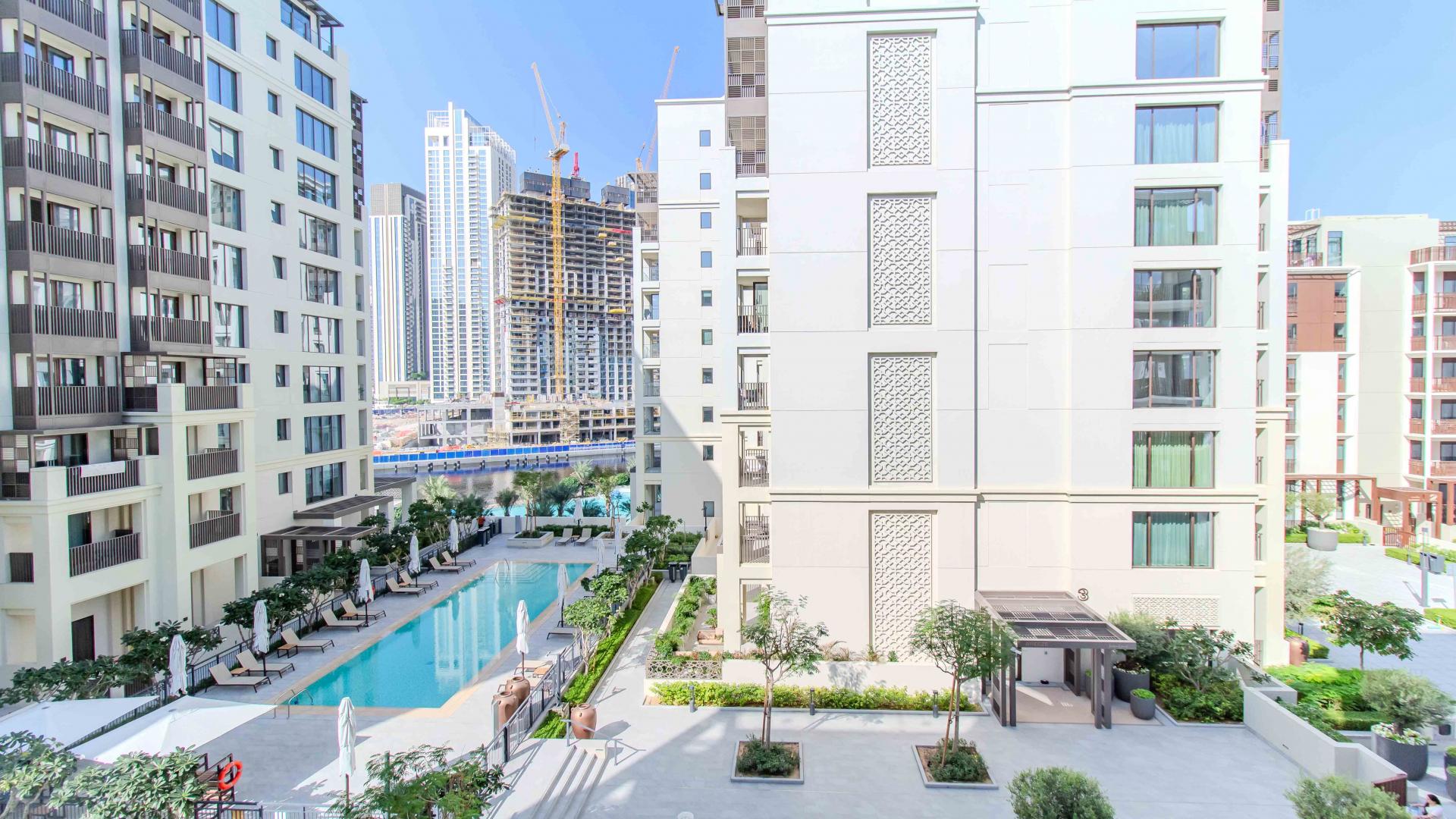 Modern living room and kitchen in 1-bedroom apartment, Breeze, Creek Beach, Dubai Creek Harbour