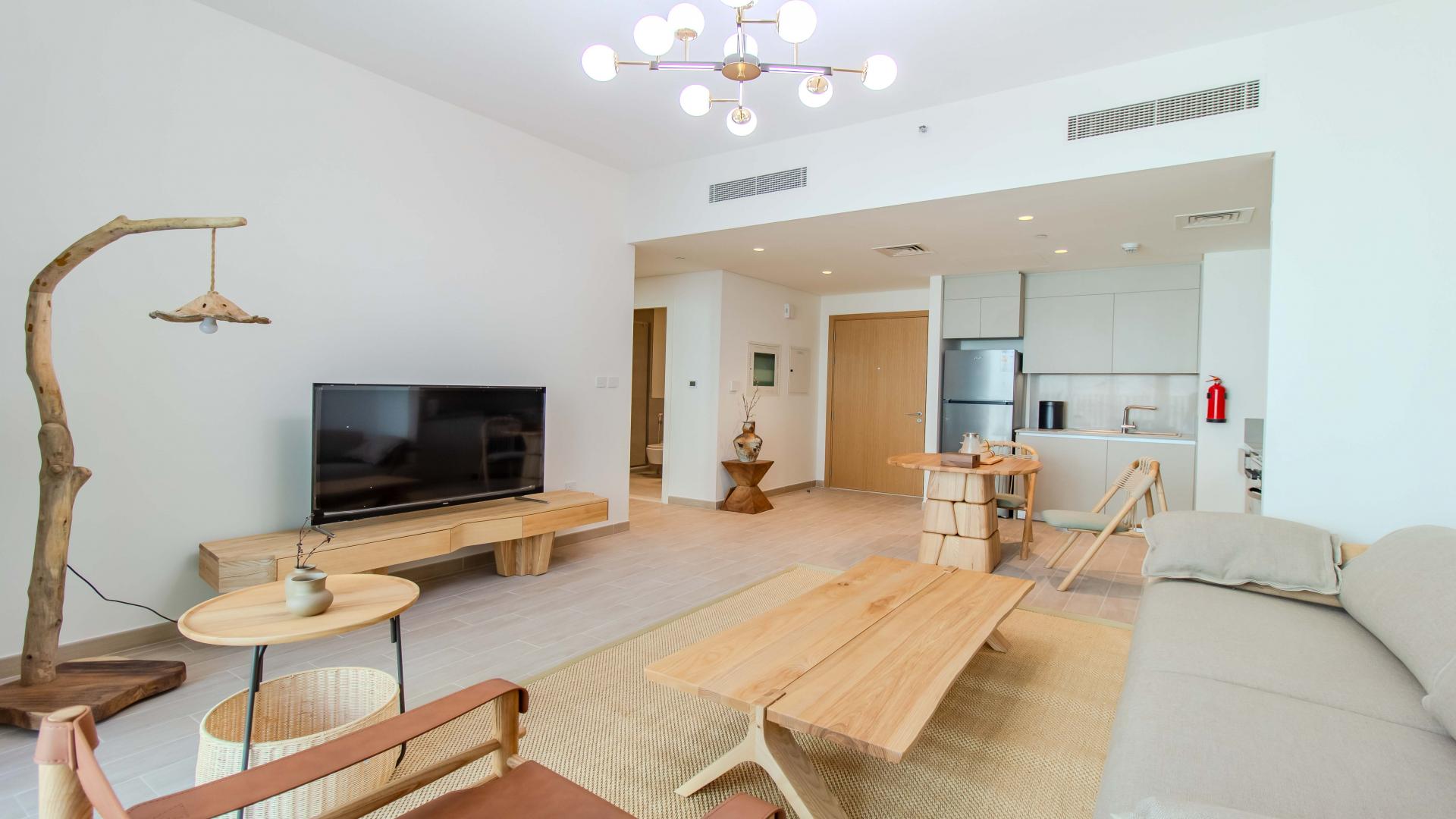 Modern apartment building with pool view in Creek Beach, Dubai Creek Harbour