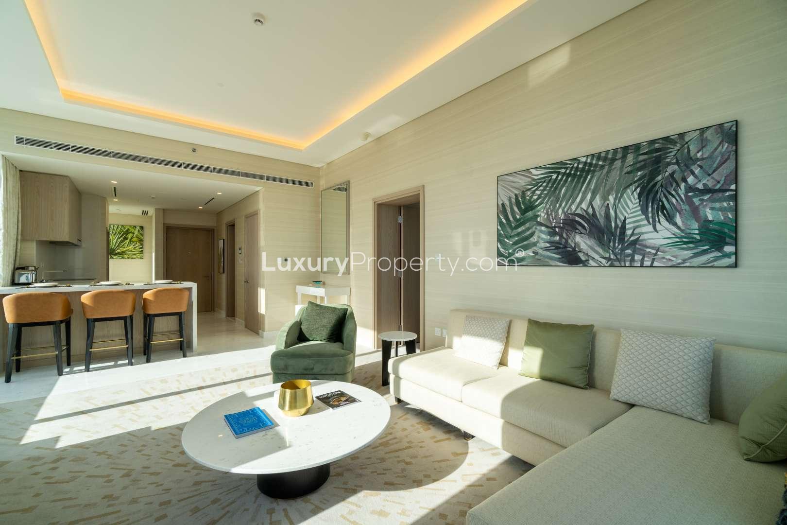 High-floor Palm Tower apartment living room with panoramic views and modern decor