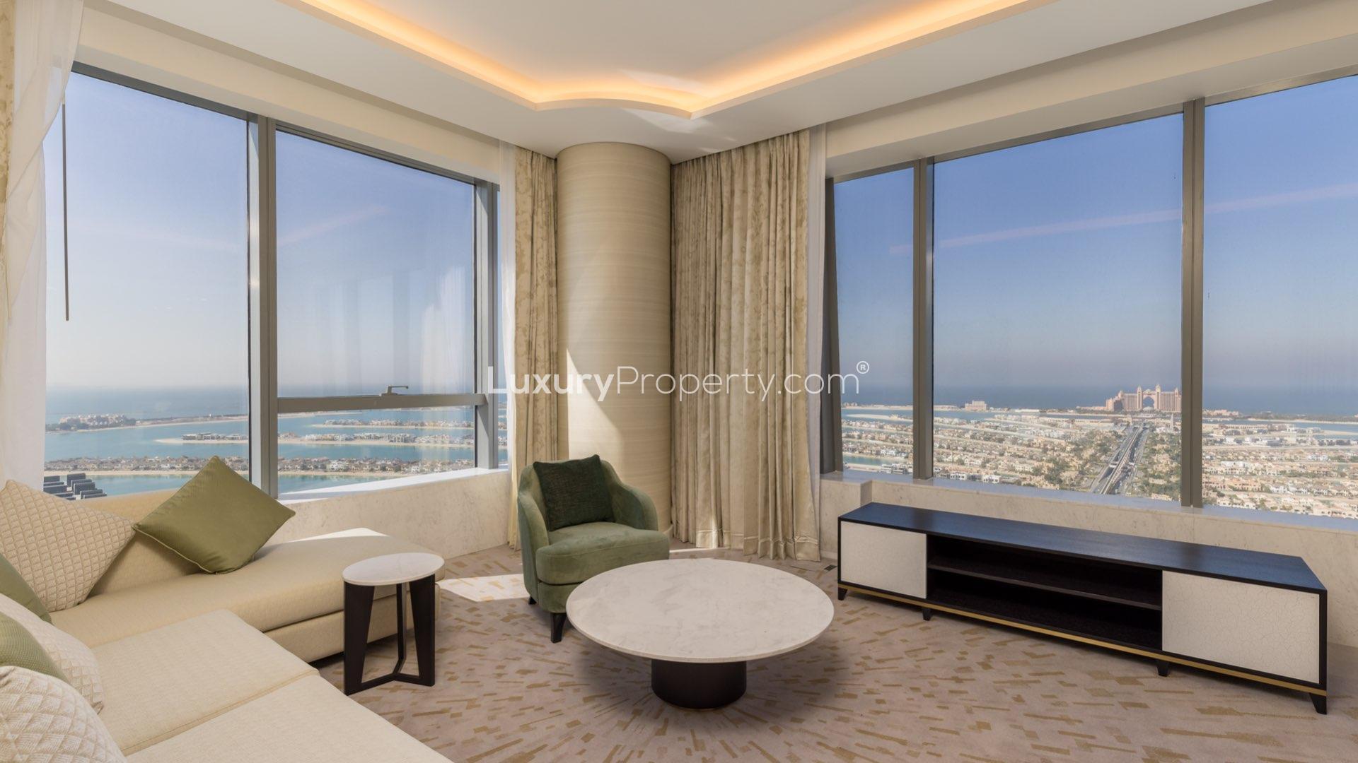 Fully furnished living room with stunning Palm Jumeirah views in The Palm Tower apartment
