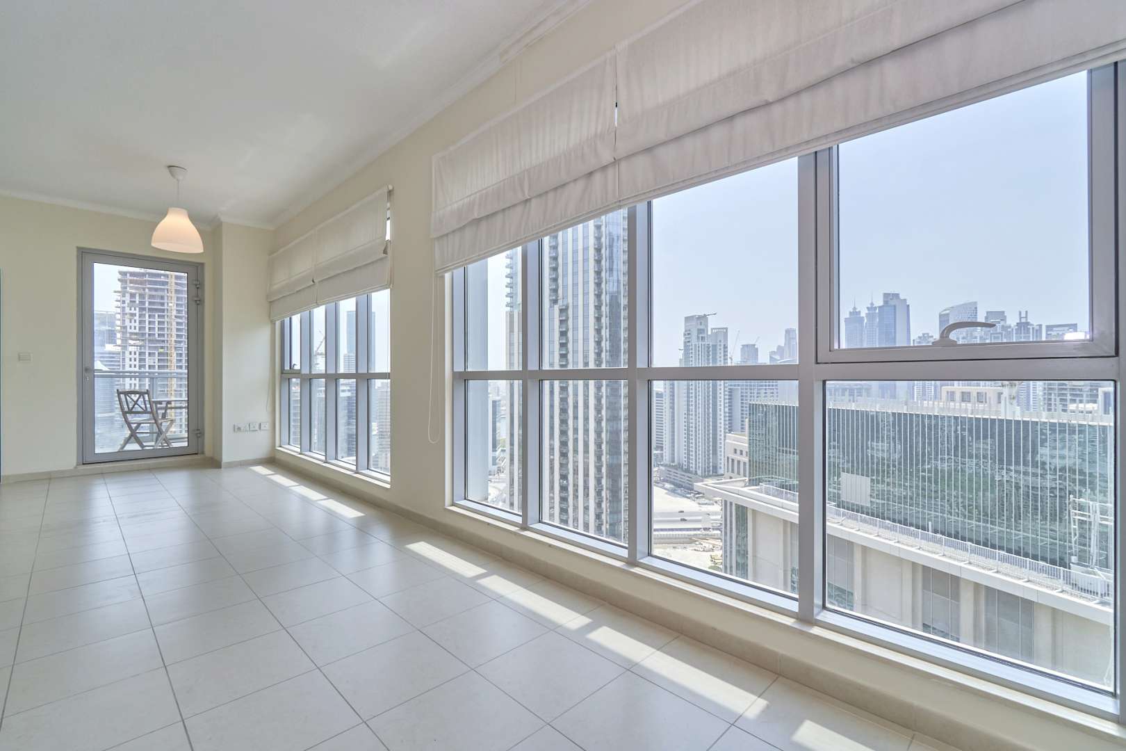 Aerial view of Downtown Dubai, skyscrapers, roads, and pool near The Residences apartment