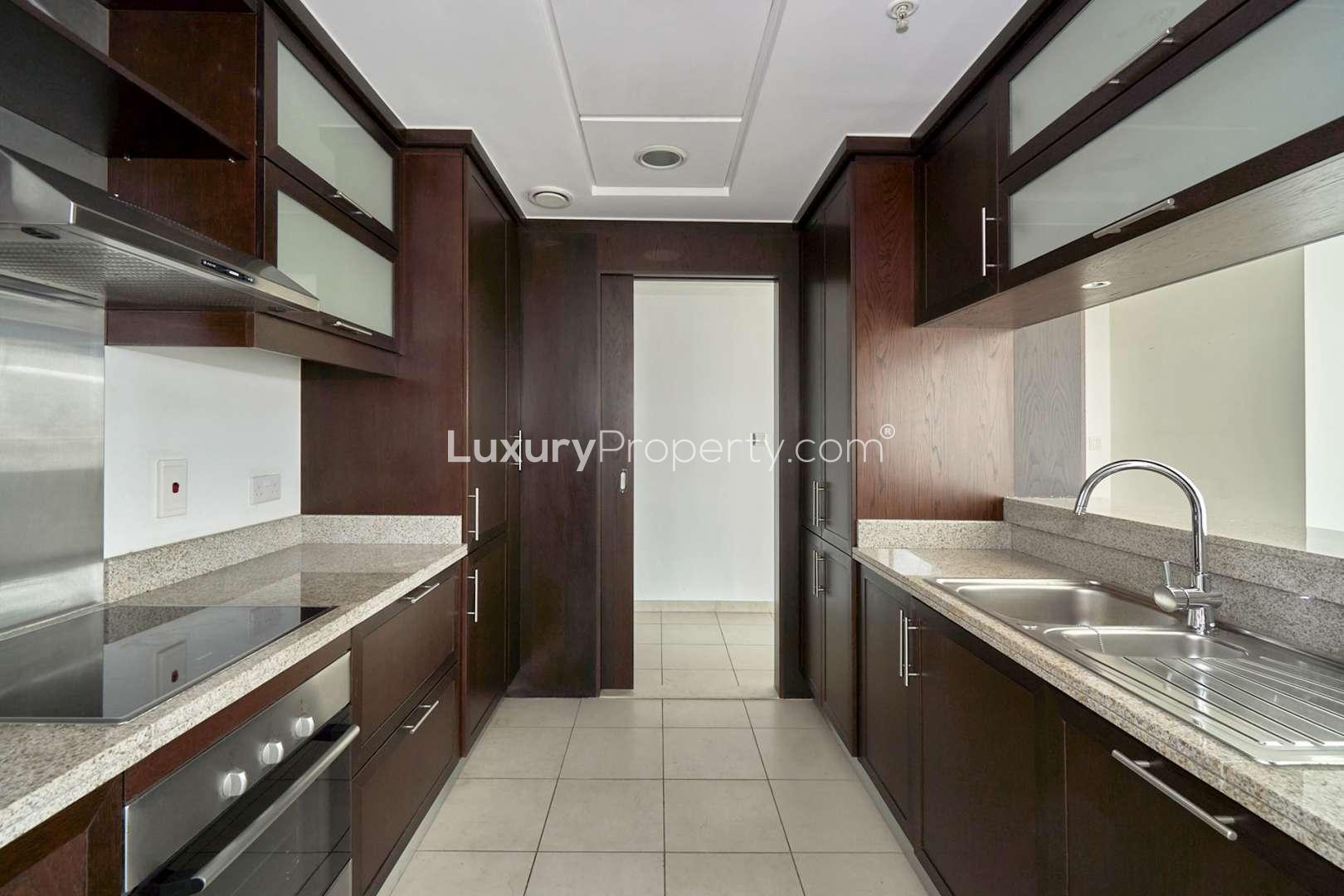 Spacious living area with large windows in Downtown Dubai apartment, The Residences