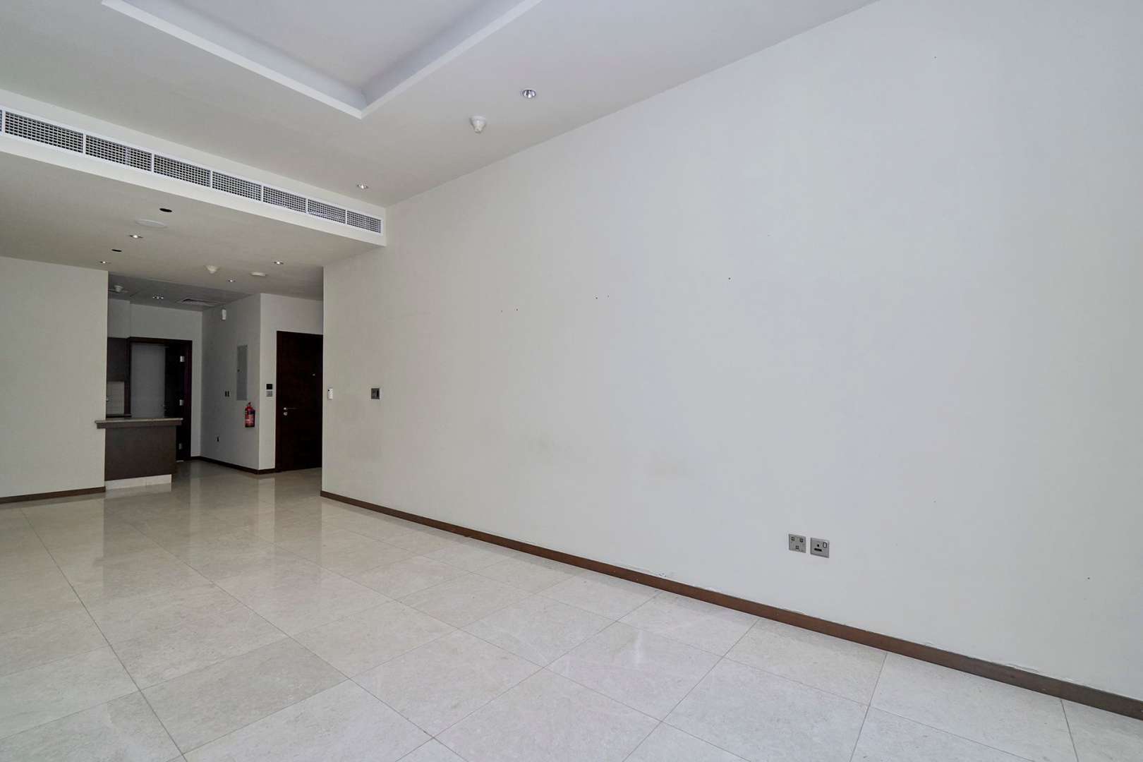 Balcony view from 1-bedroom apartment in Tiara Residences, Palm Jumeirah, overlooking lush greenery