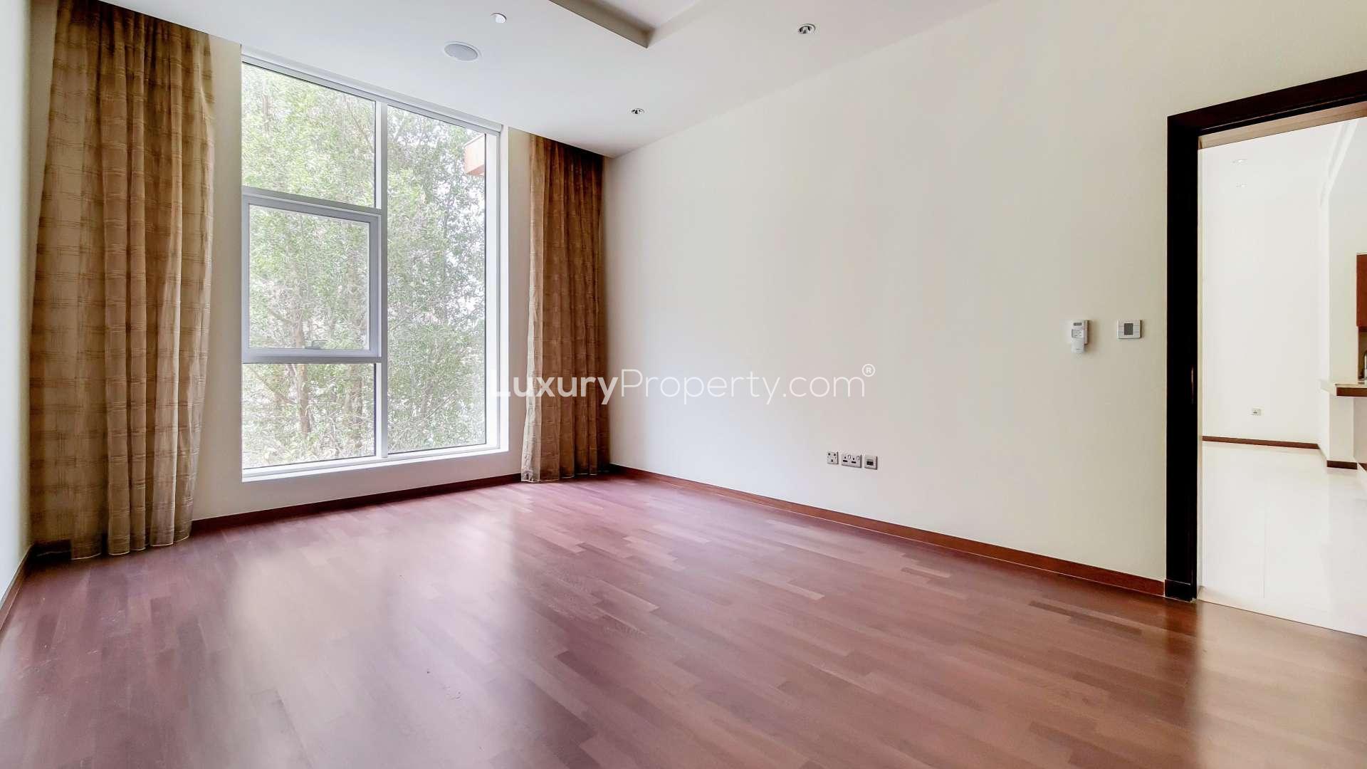 Balcony view from Tiara Residence apartment, lush greenery and modern architecture, Palm Jumeirah